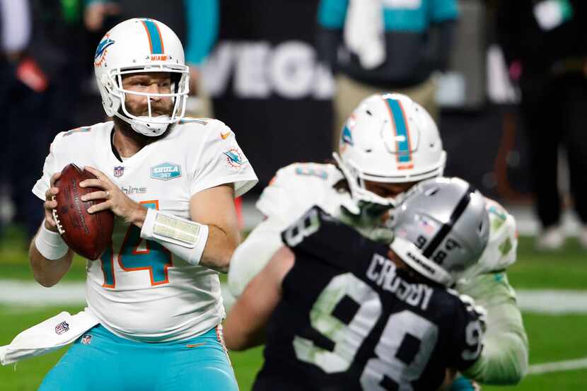 FILE — Miami Dolphins quarterback Ryan Fitzpatrick (14) looks to throw against the Las Vegas...