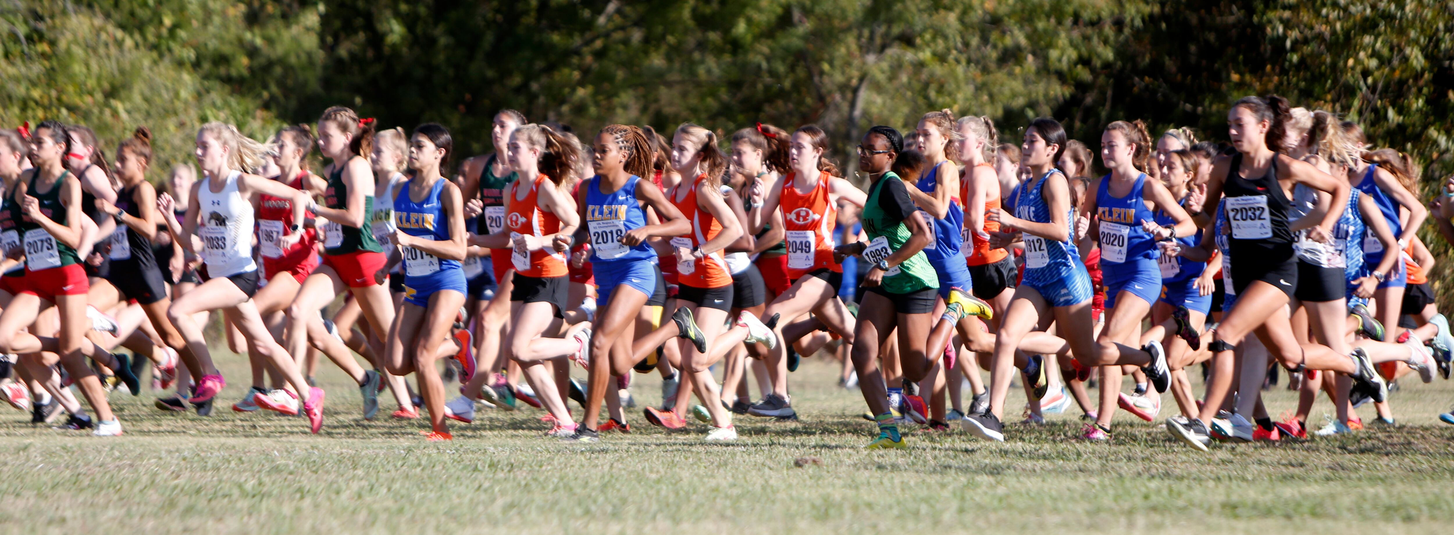 Runners get off from the starting line in the girls race. The Class 6A Region ll cross...
