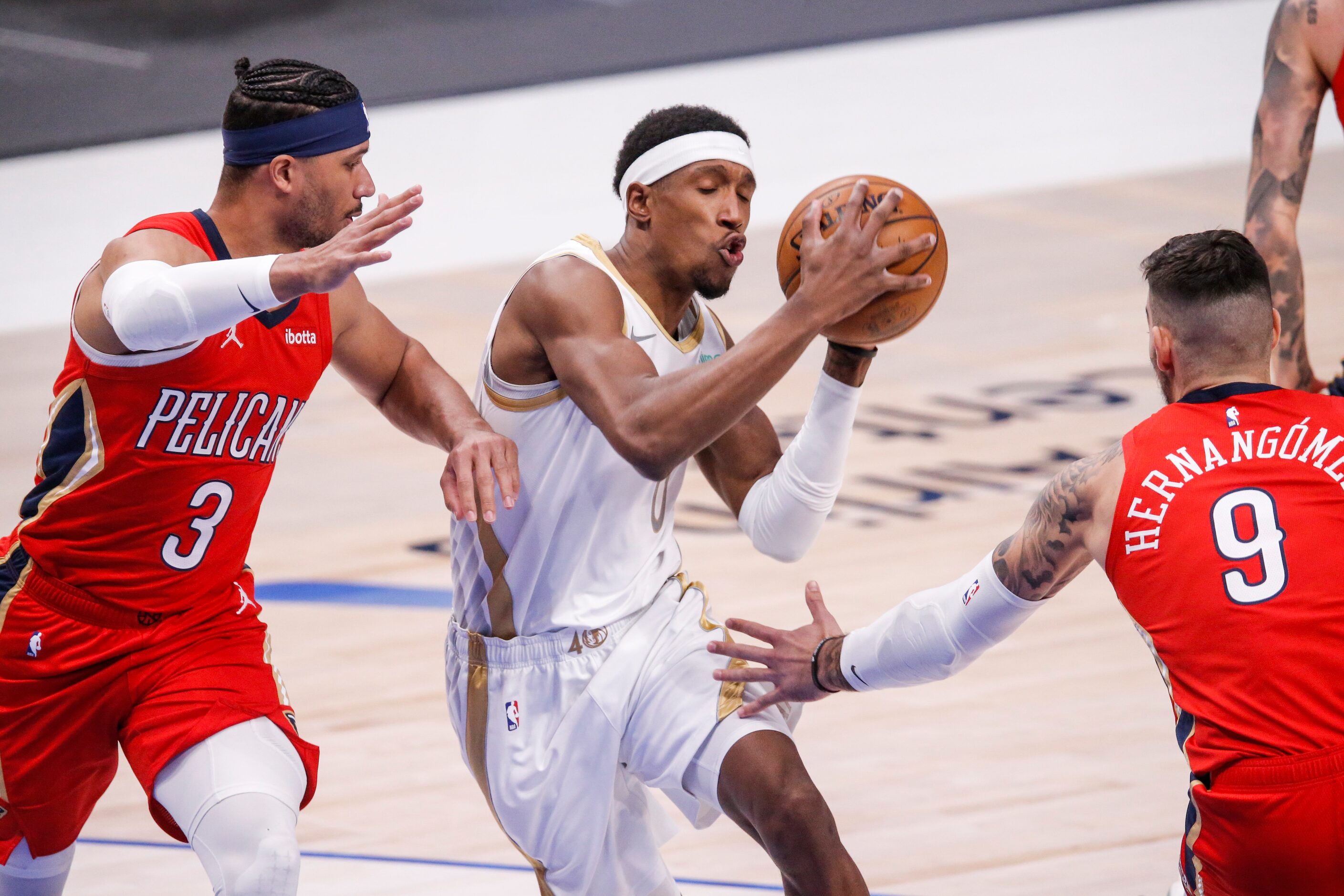 Dallas Mavericks guard Josh Richardson (0) battles New Orleans Pelicans guard Josh Hart (3)...