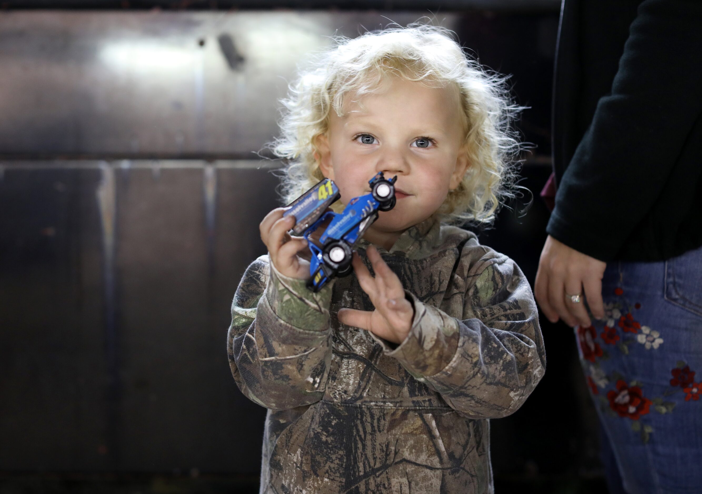 3-year-old Anderson Cox receives a new toy sprint car at Devil's Bowl Speedway. (Jason...