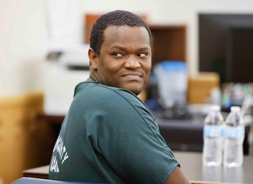 Reginald Kimbro looks back towards his family members Tuesday.