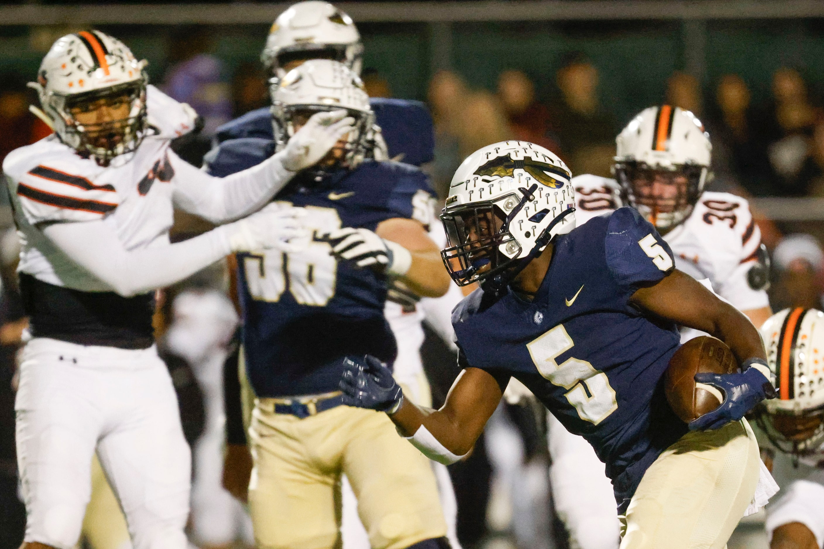 Keller high’s Cameron Rayford (5) runs the ball for a touchdown against Haltom high during...