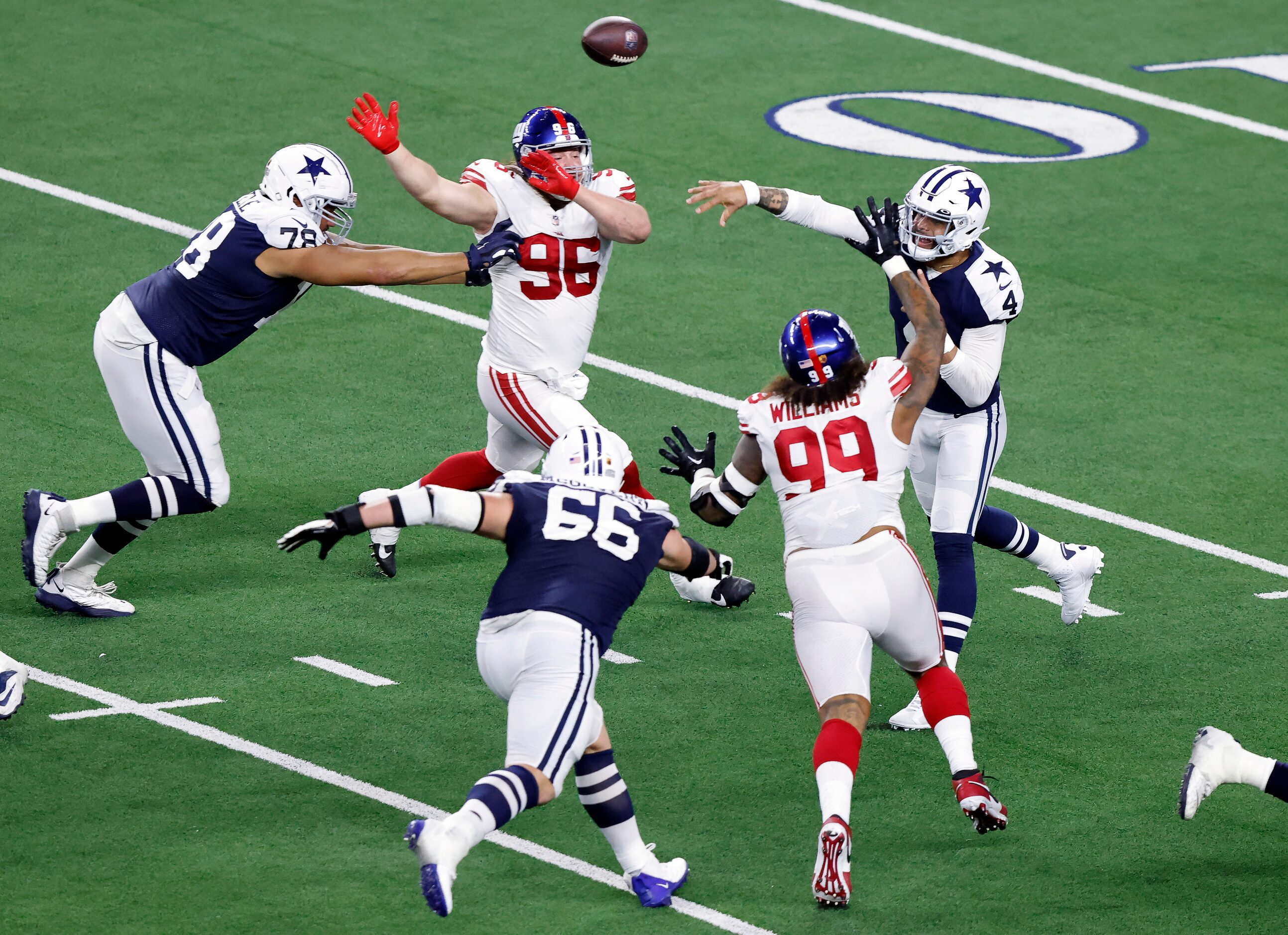 Dallas Cowboys quarterback Dak Prescott (4) throws a second quarter pass against the New...