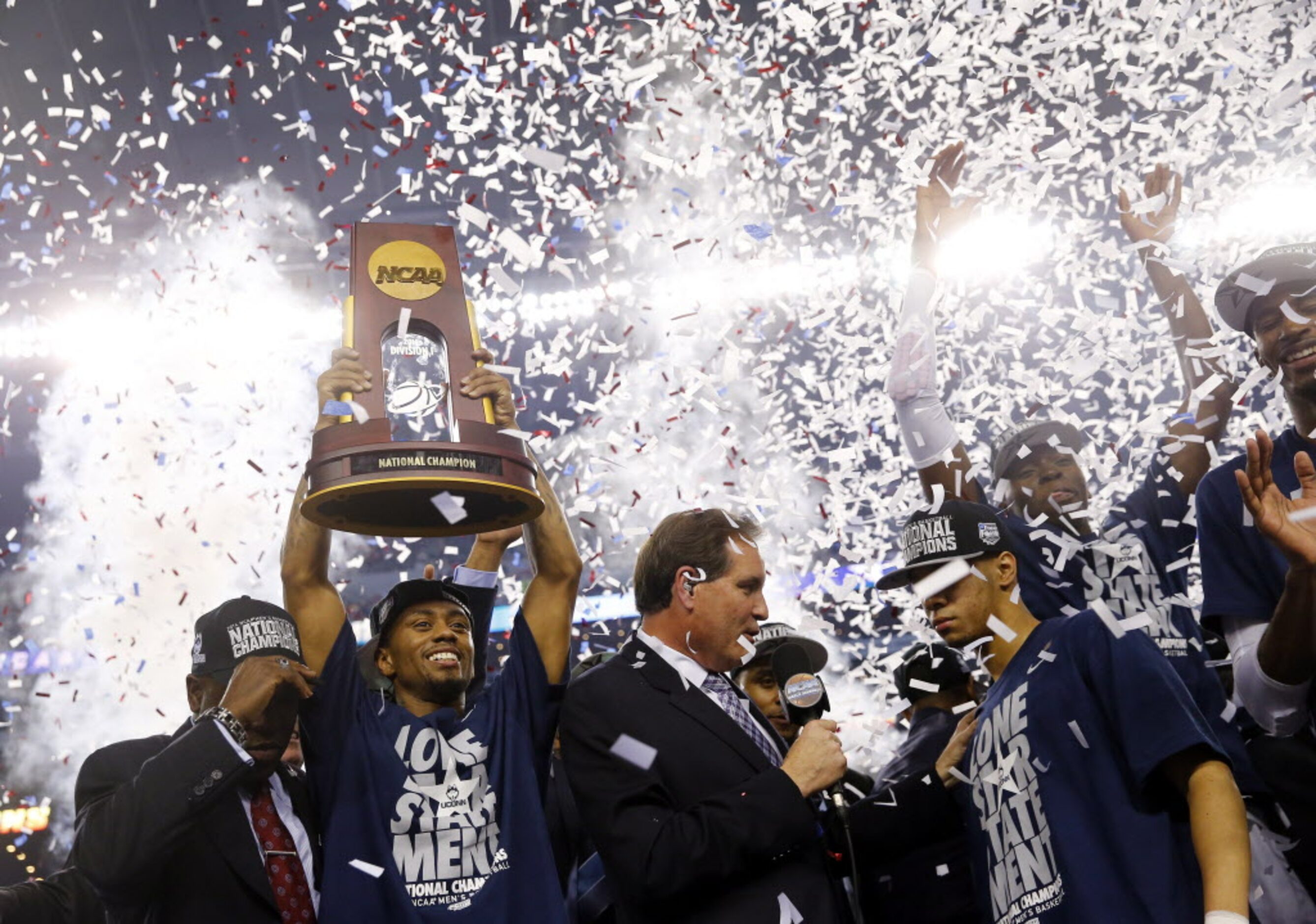 Connecticut Huskies guard Ryan Boatright (11) and teammates celebrate following the Huskies'...