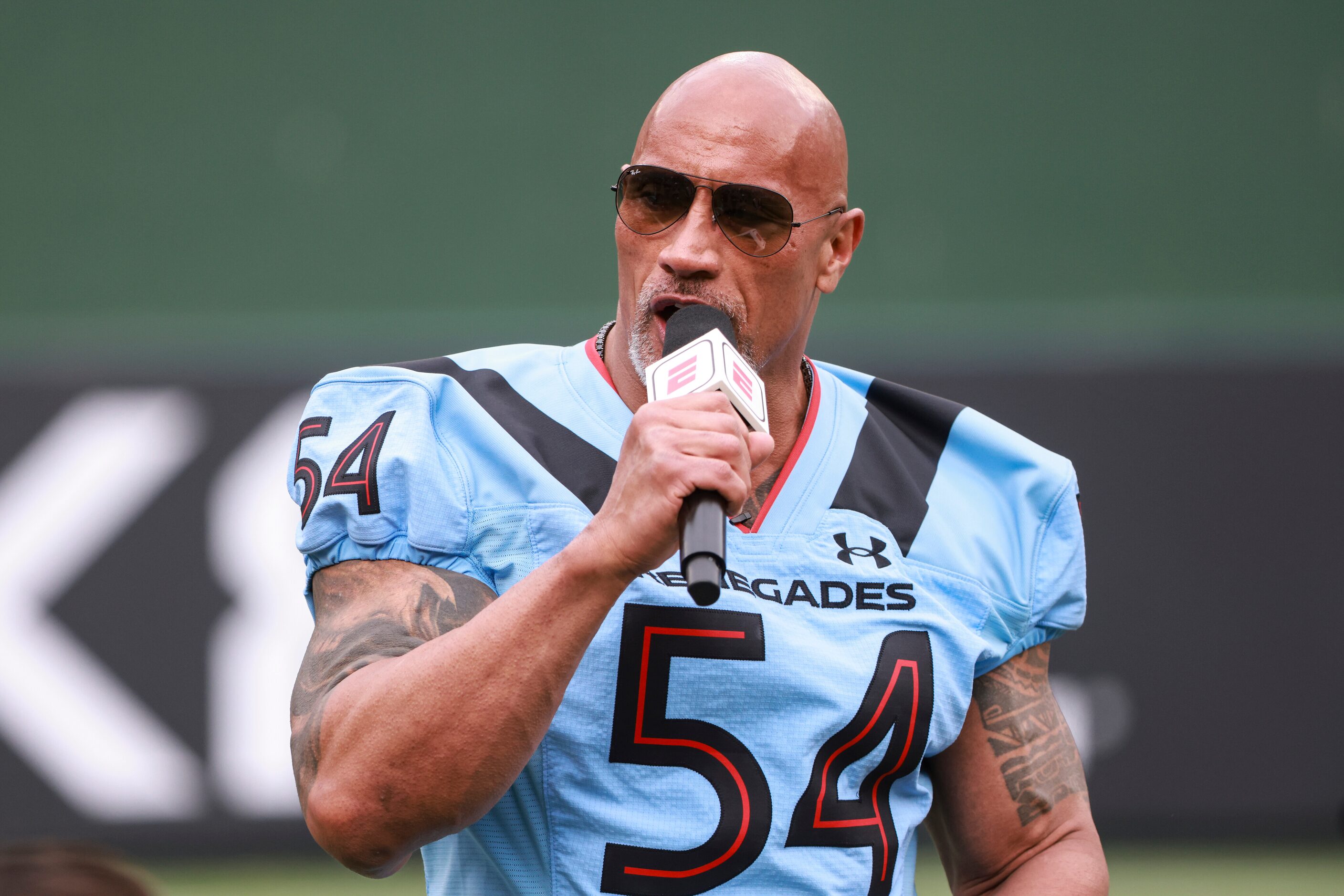 Dwayne “The Rock” Johnson hypes up the Arlington Renegades and crowd before the game at...