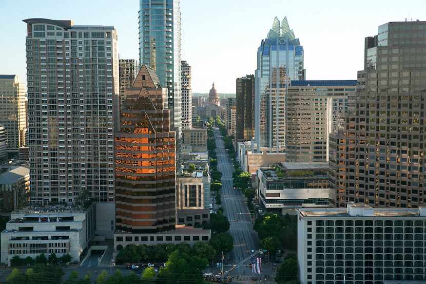 Aerial view of downtown Austin including the Texas Capitol up Congress Avenue.