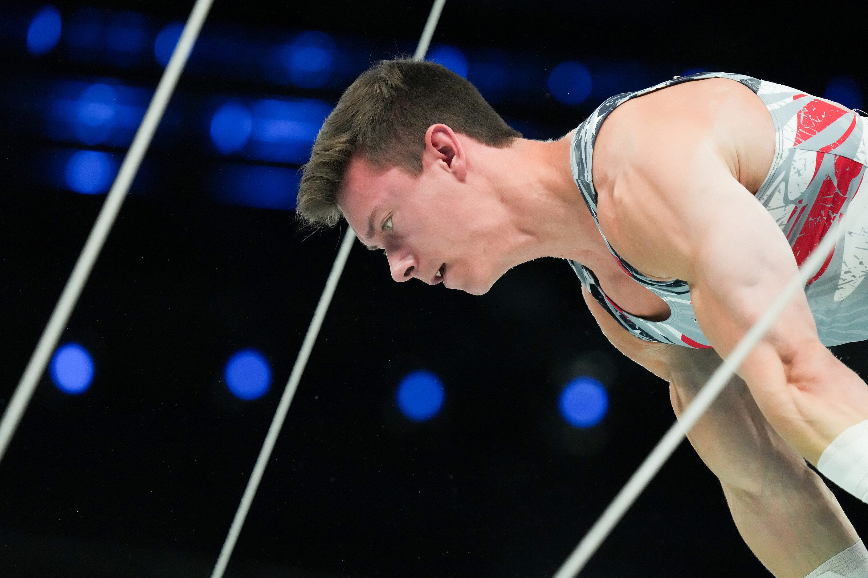 Brody Malone of the United States competes on the rings during the men’s gymnastics team...