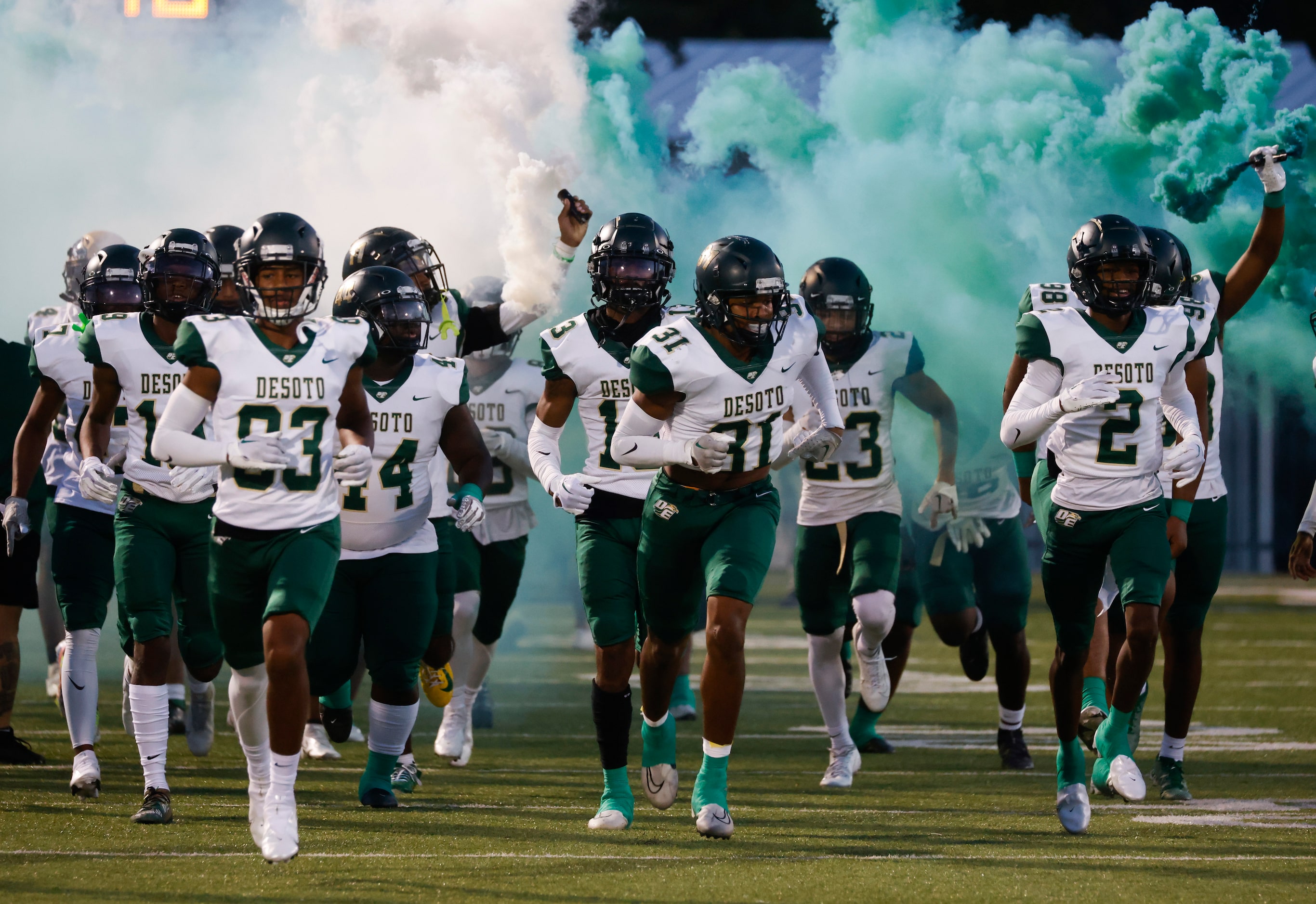 DeSoto high players enter the field ahead of their game against Lake Ridge High during a...