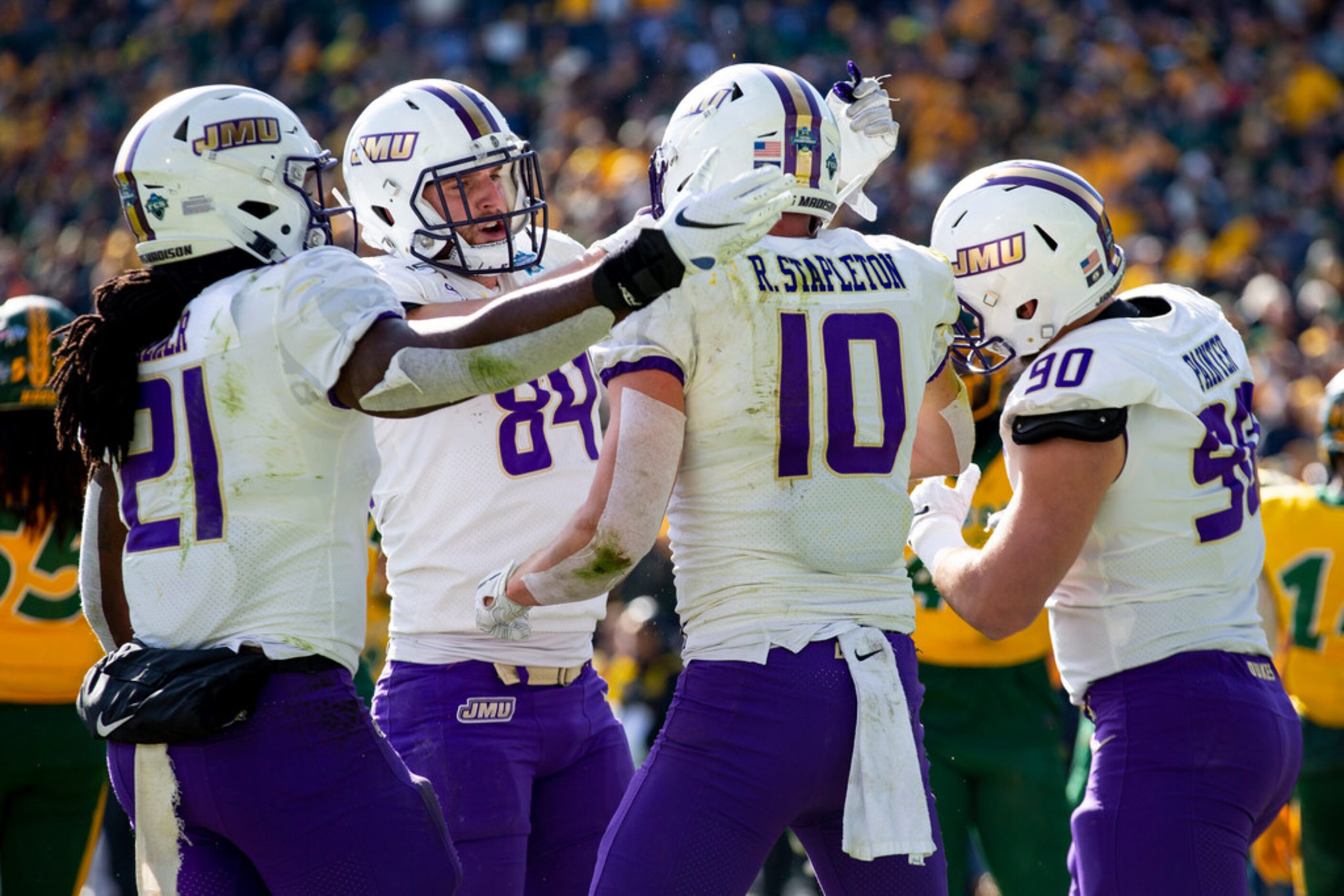 James Madison wide receiver Riley Stapleton (10) is congratulated by running back Latrele...