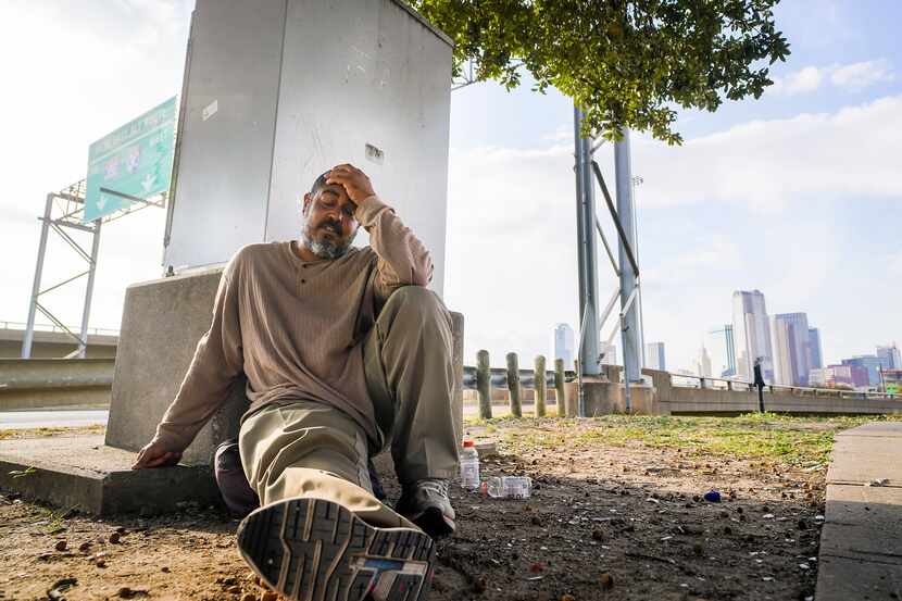 OurCalling client Jeremy Medford sat on the sidewalk near the Dallas facility on Thursday.