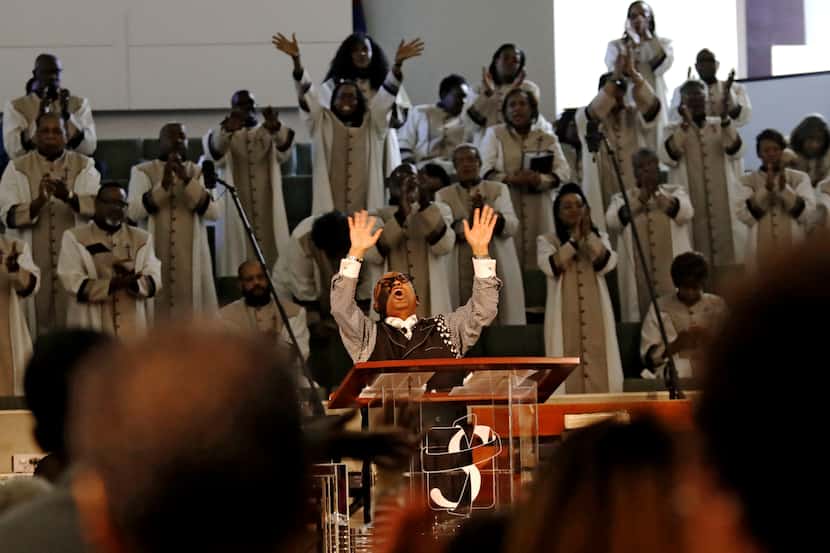Pastor Isiah Joshua lifts his hands heavenward while preaching at Shiloh Missionary Baptist...