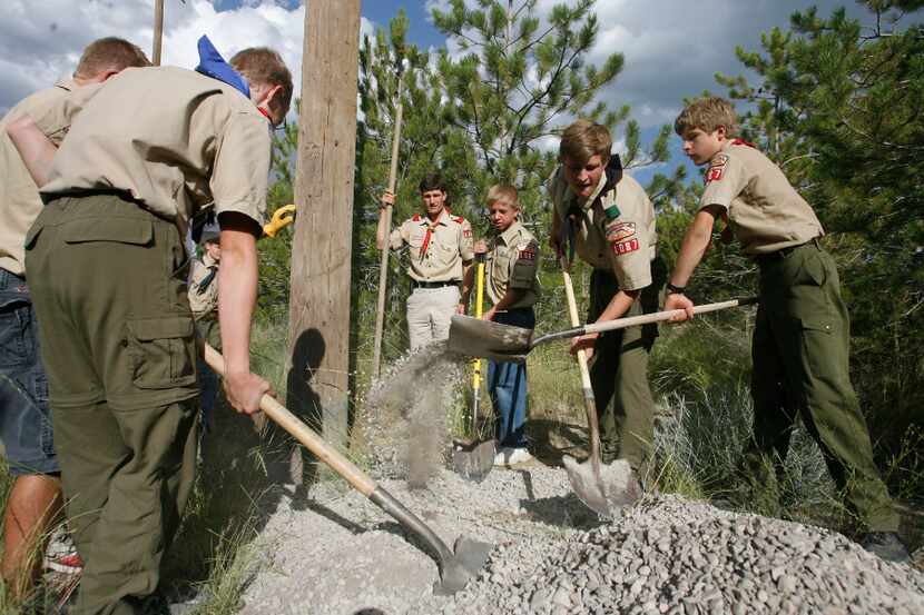 Scouts from Eagle Mountain, Utah, work on a service project. This year, the Mormon church,...