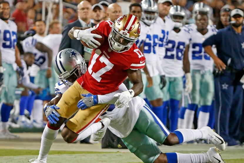 San Francisco 49ers wide receiver Victor Bolden (17) is tackled by Dallas Cowboys safety...