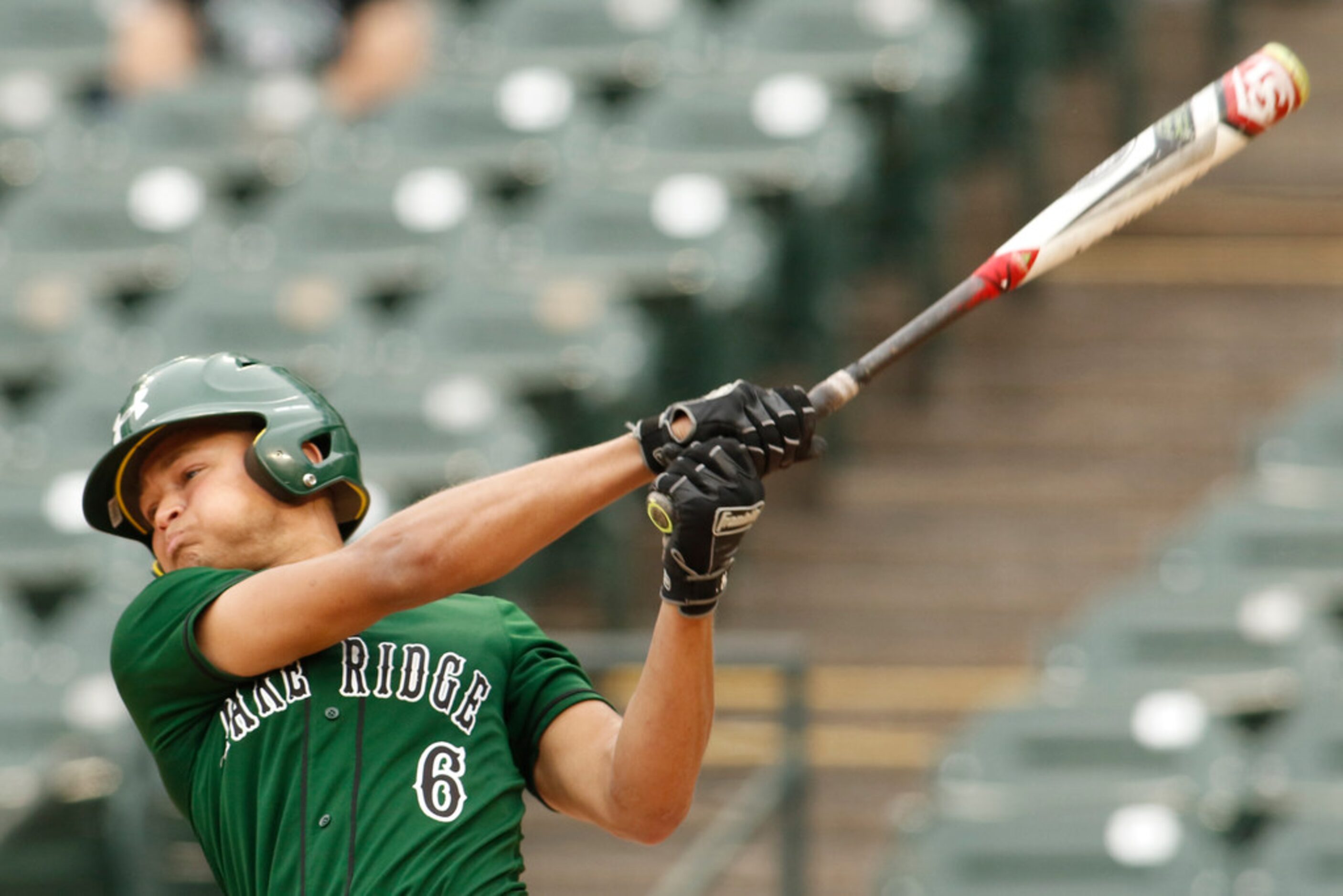 Mansfield Lake Ridge infielder Talon Simmons (6) swings for the fences but can't make...