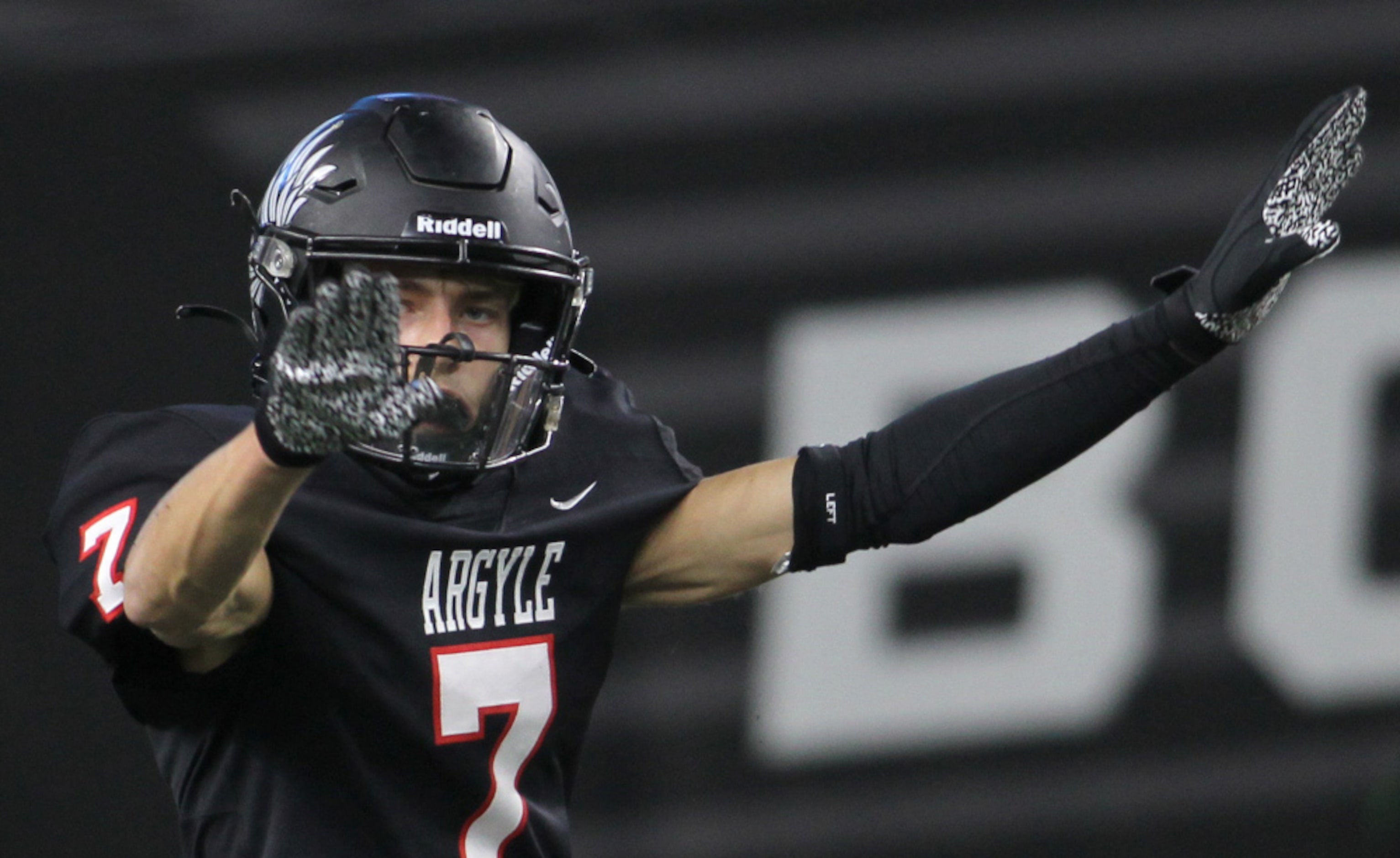 Argyle defensive back Jeff Copeland (7) mimics the call on the field by game officials of an...