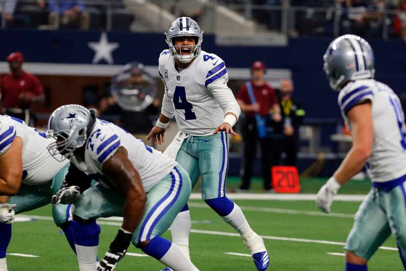 Dallas Cowboys quarterback Dak Prescott (4) yells instructions during ta play in the the...