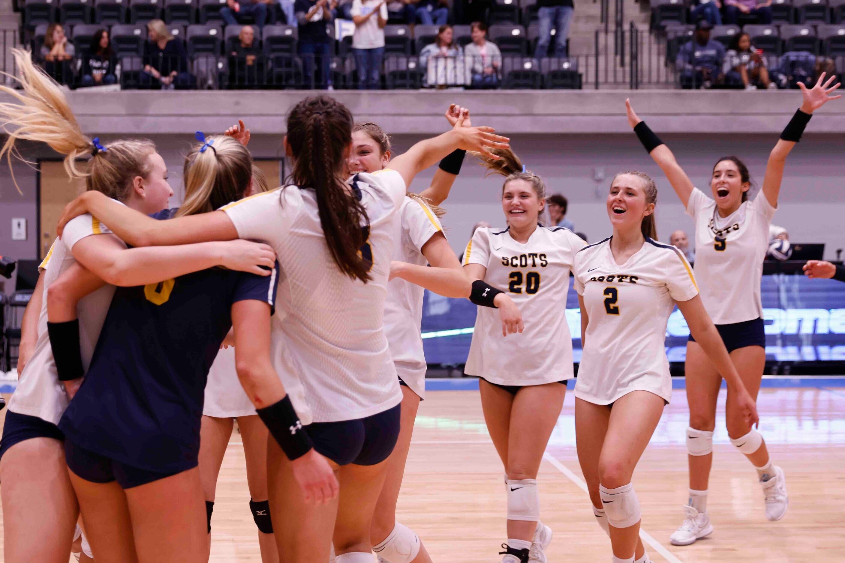 Highland Park players celebrate after winning against Flower Mound during a volleyball game...