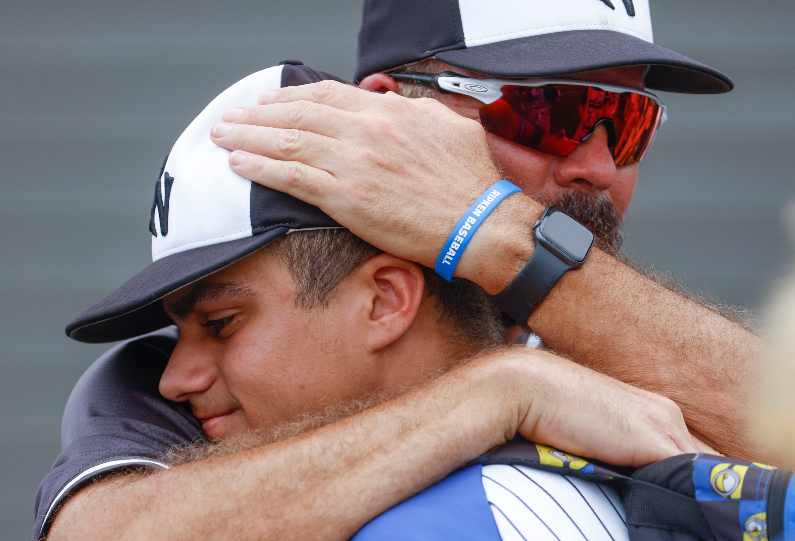 Byron Nelson High School’s pitcher Luis Santiago Castro gets comforted by a coach after...