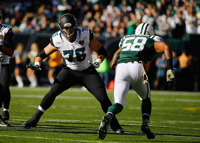 EAST RUTHERFORD, NJ - NOVEMBER 08:  Luke Joeckel #76 of the Jacksonville Jaguars defends...