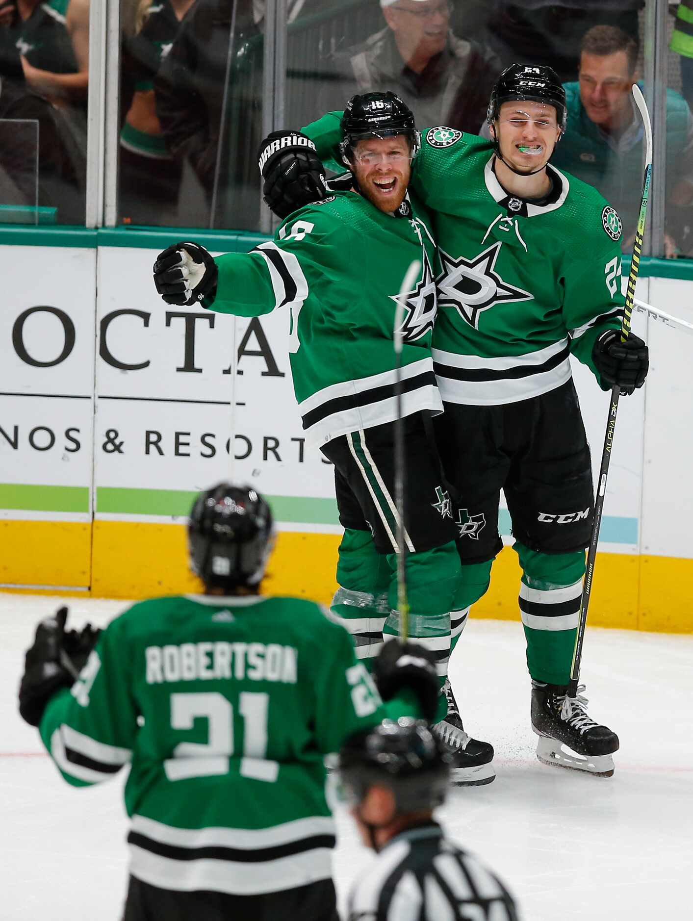 Dallas Stars forward Joe Pavelski (16) is congratulated by forwards Roope Hintz (24) and...