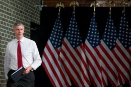  U.S. Education Secretary Arne Duncan takes the stage at a town hall in Des Moines earlier...