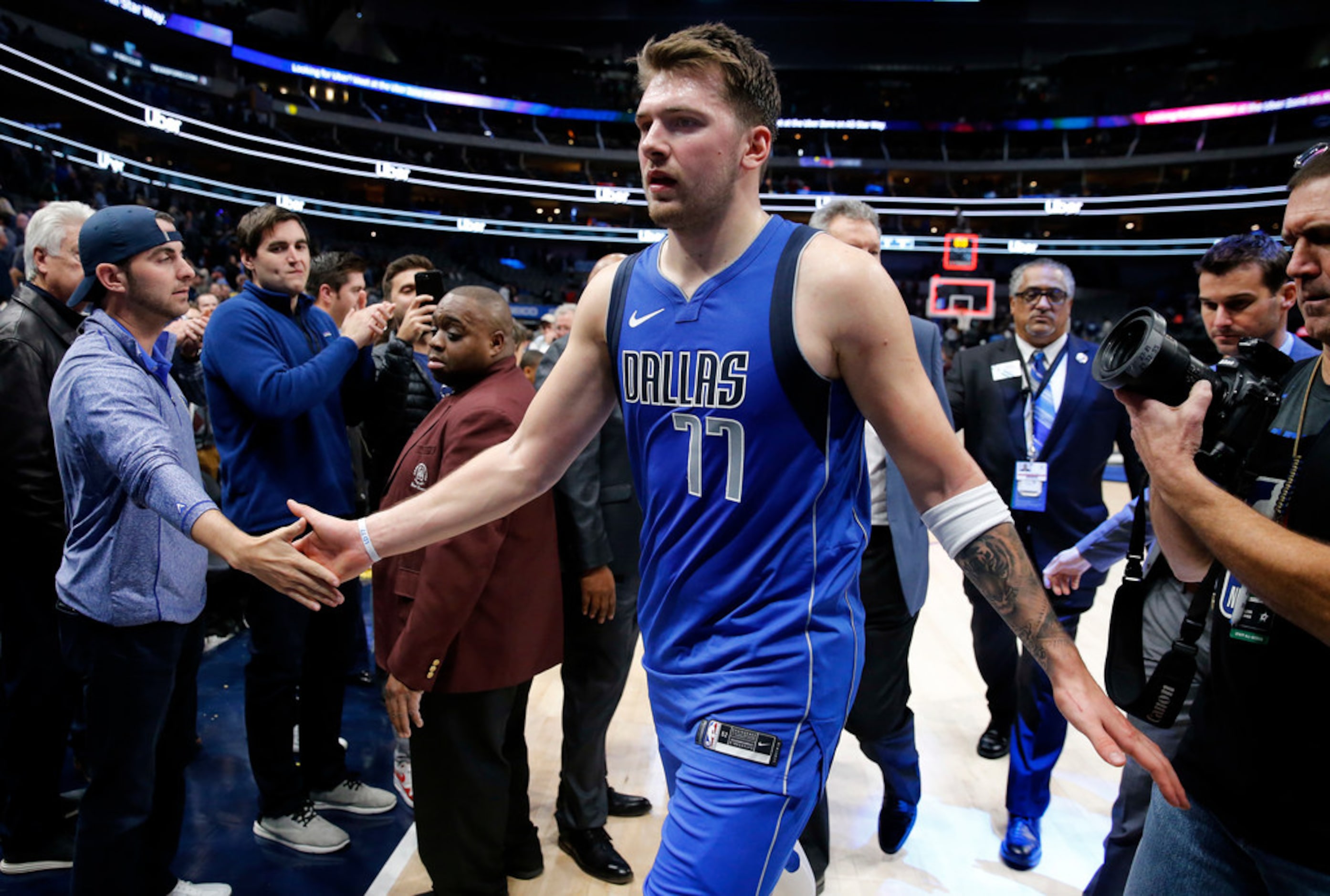 Dallas Mavericks forward Luka Doncic (77) is congratulated by fans after their win over the...