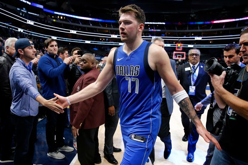 Dallas Mavericks forward Luka Doncic (77) is congratulated by fans after their win over the...