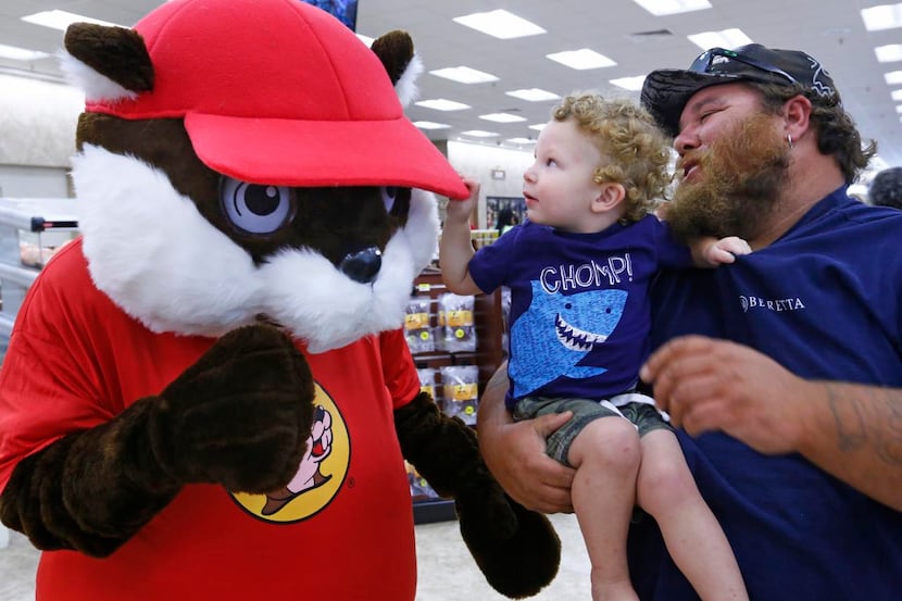 
Doug Rommell and his 23-month-old son, Hunter, of Mesquite checked out the Buc-ee’s mascot...