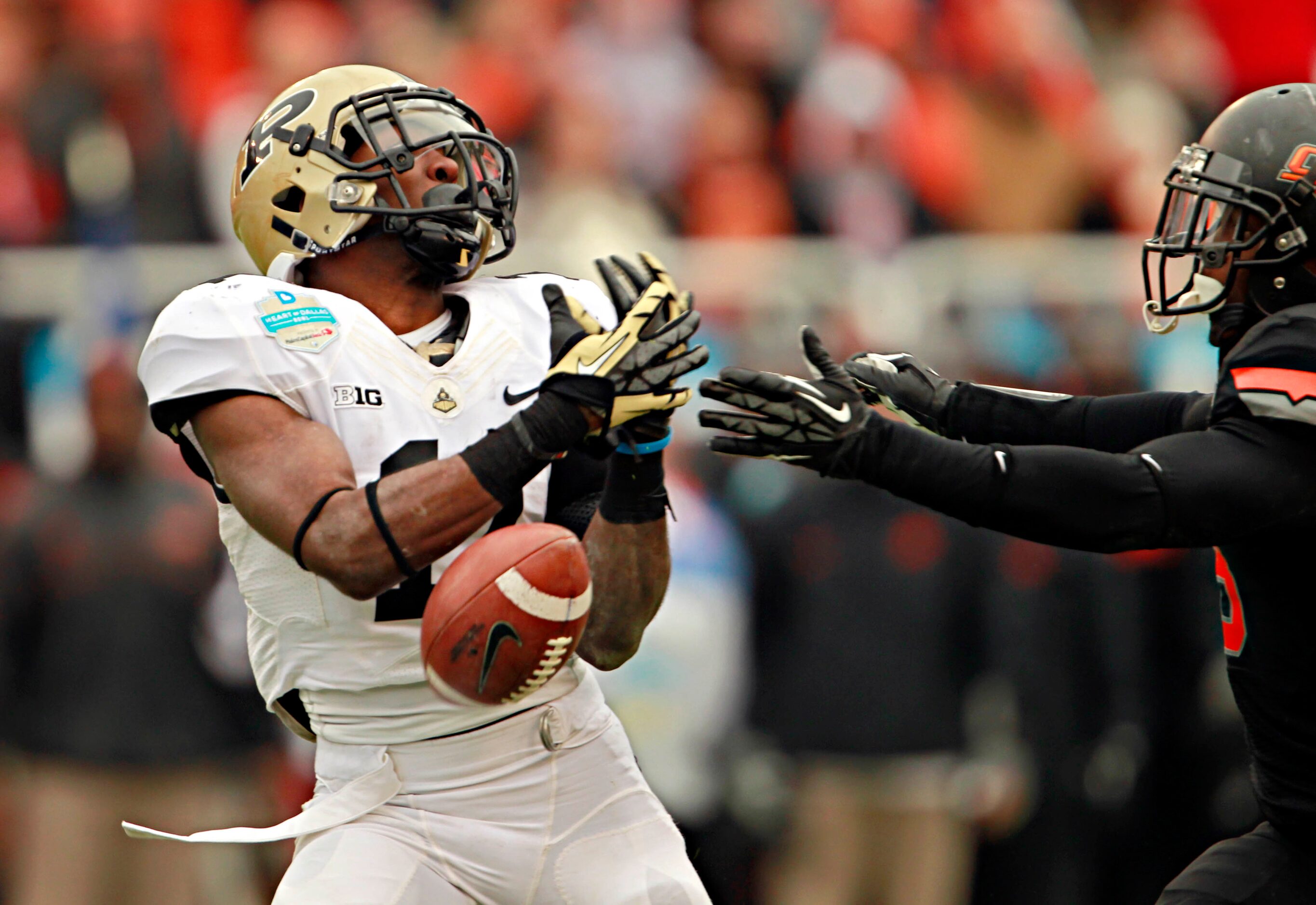 Purdue Boilermakers running back Akeem Hunt (11) can't keep possession of a pass under...