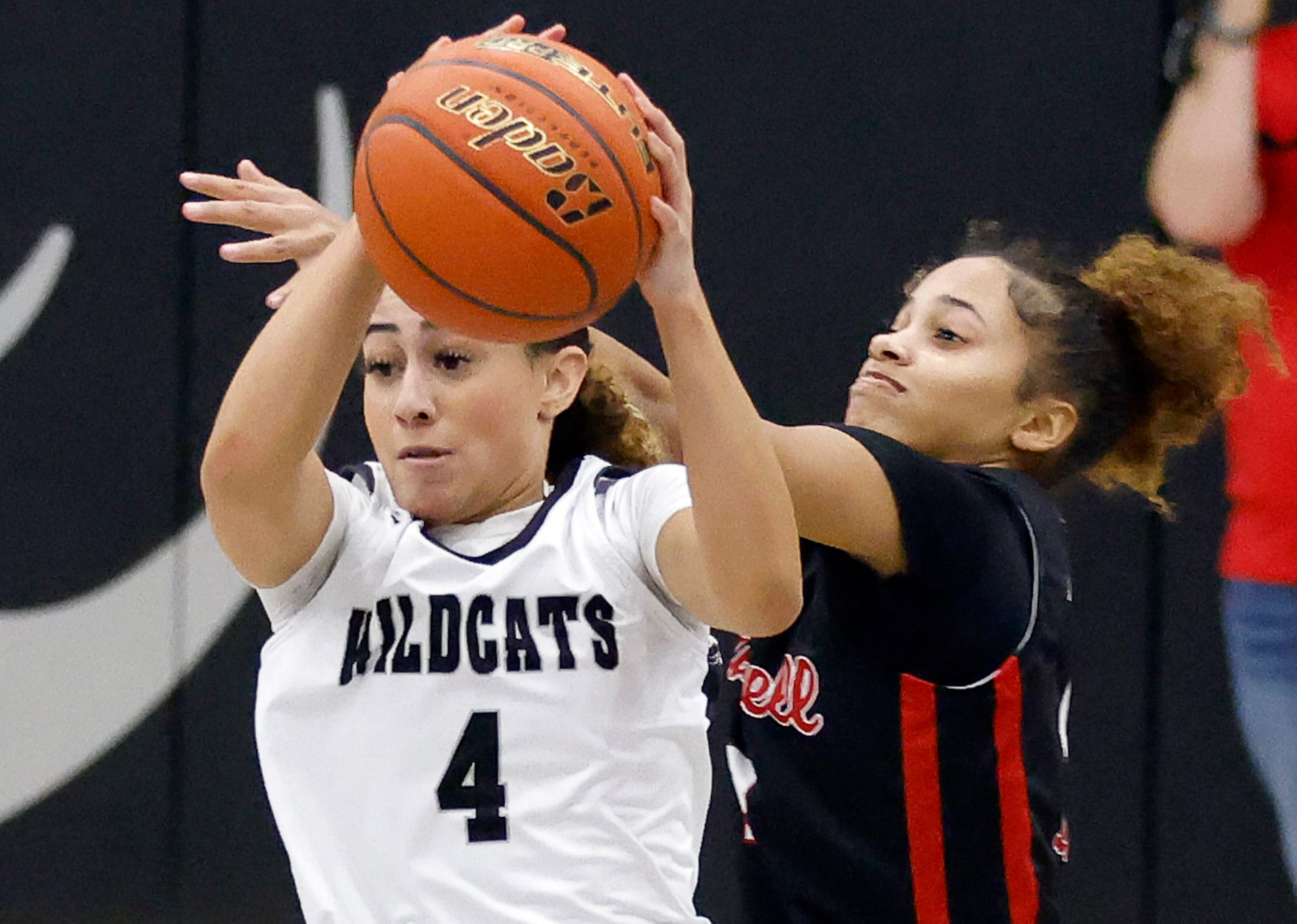 Denton Guyer guard Baylee Bowman (4) steps in front of Denton Braswell’s Sienna Barnes (12)...