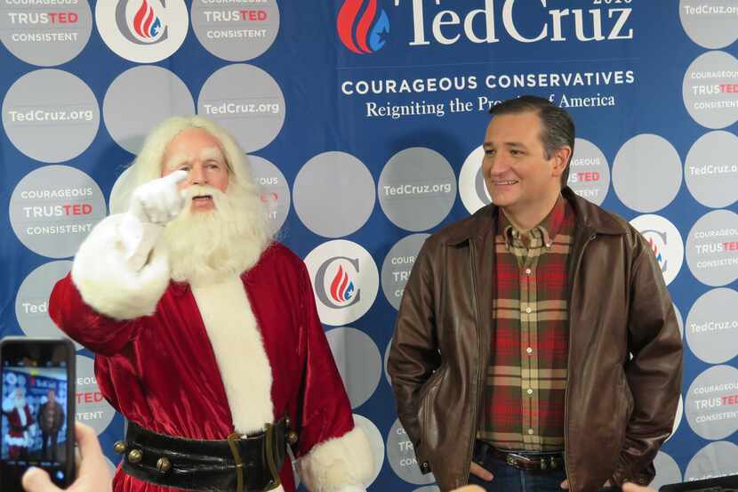  Sen. Ted Cruz appears with Santa Claus ahead of a campaign rally Friday afternoon at Life...