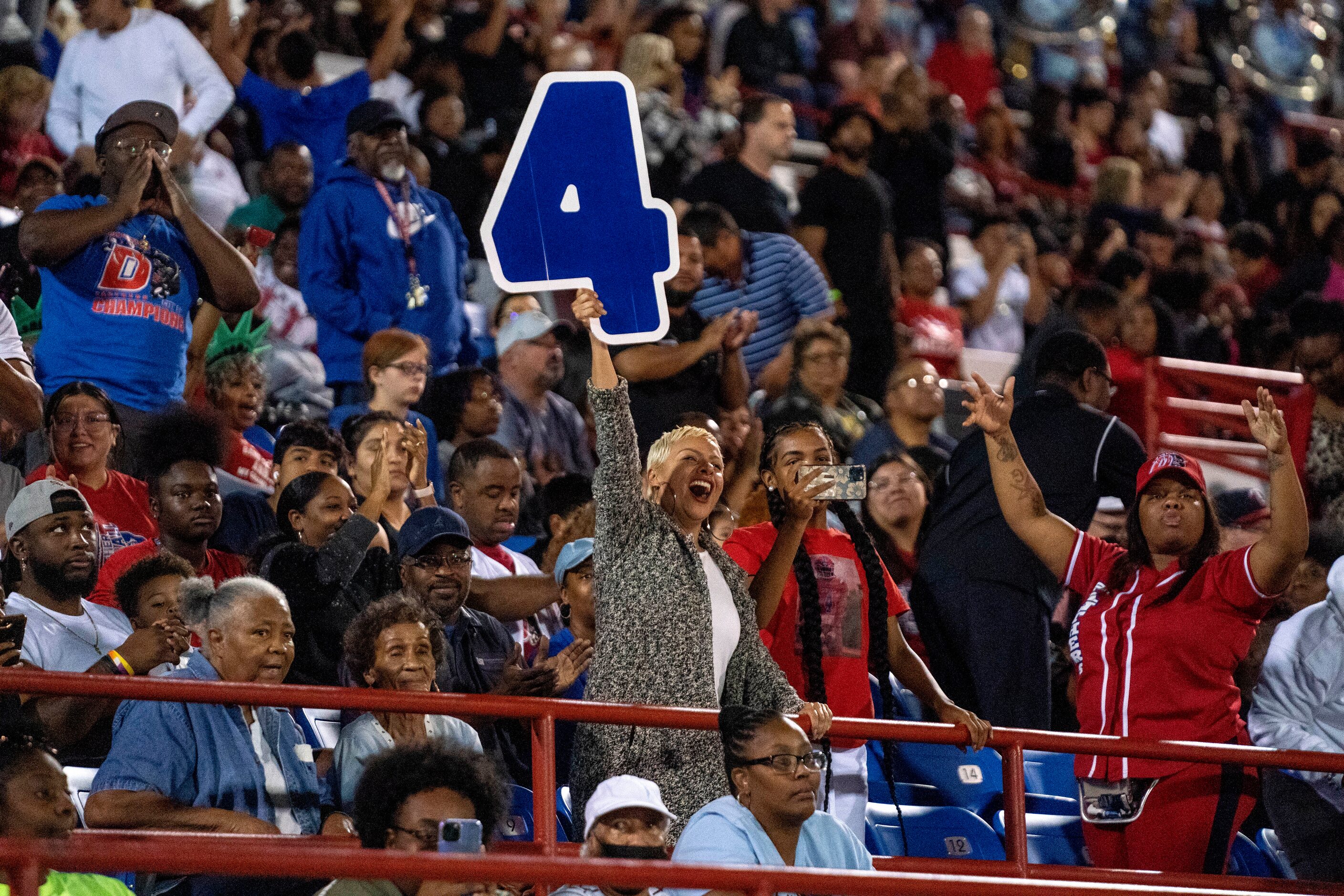 Duncanville fans cheer after a touchdown during the second half of a high school football...