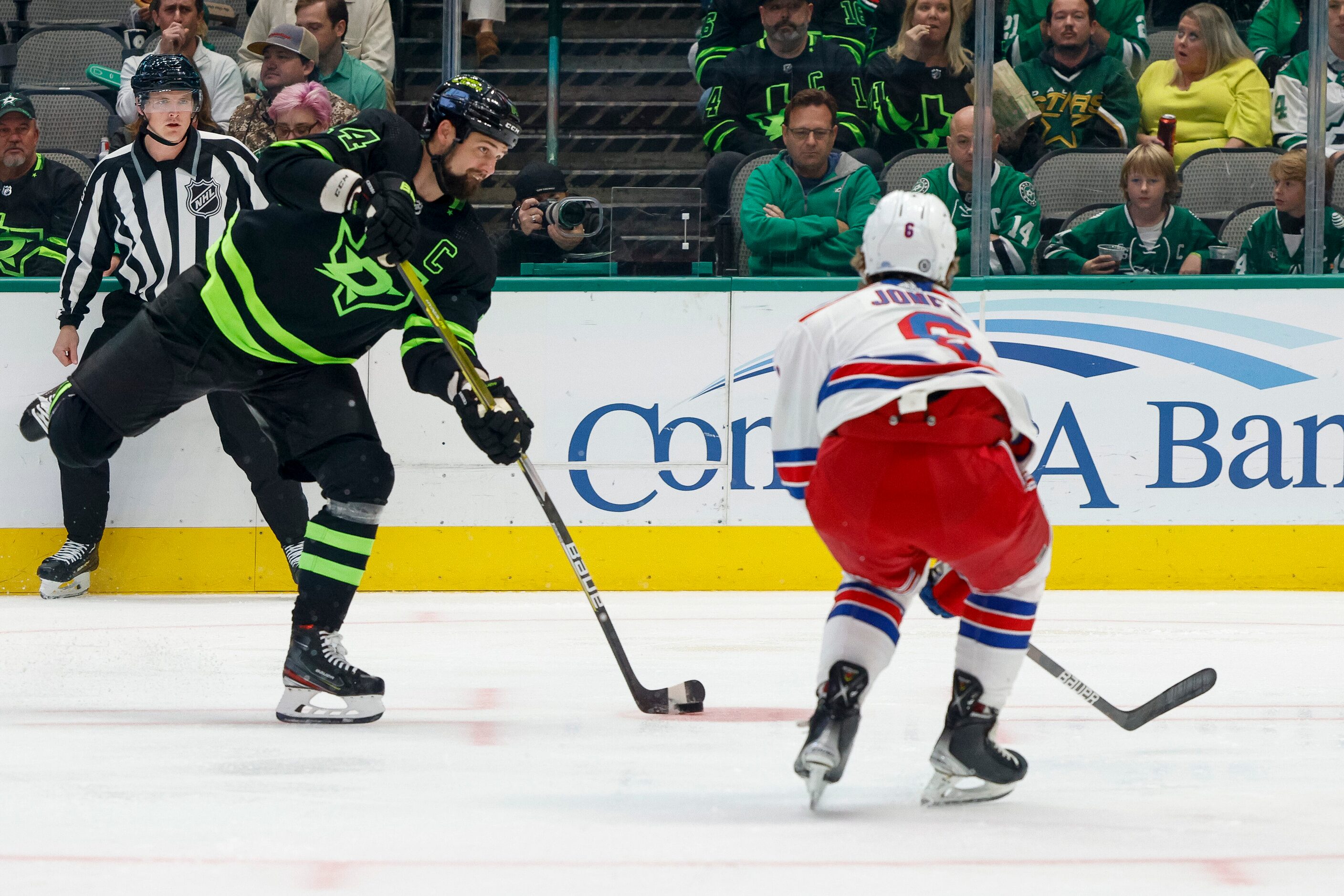 Dallas Stars left wing Jamie Benn (14) shoots the puck past New York Rangers defenseman Zac...