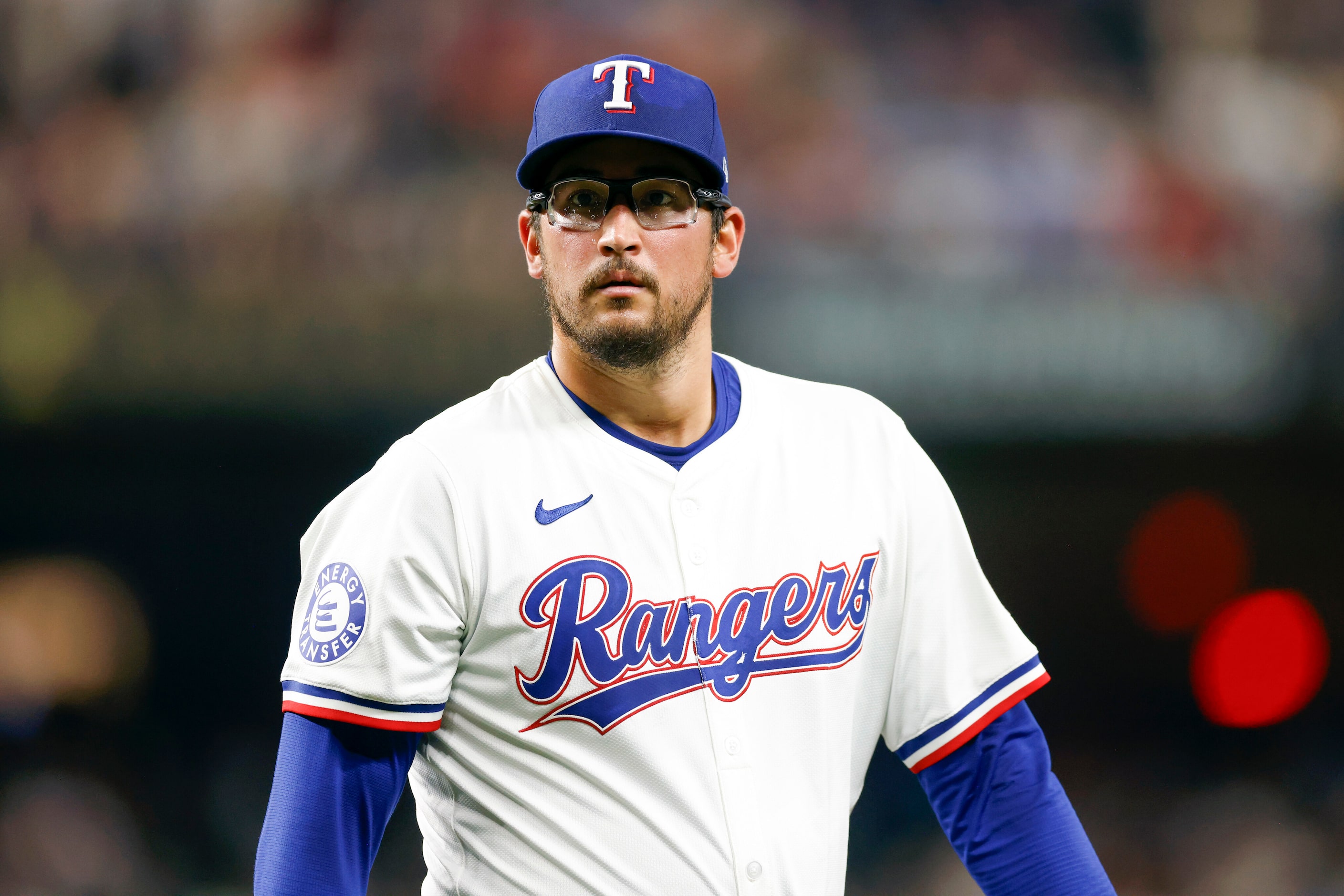 Texas Rangers starting pitcher Dane Dunning (33) heads to the dugout after the top half of...