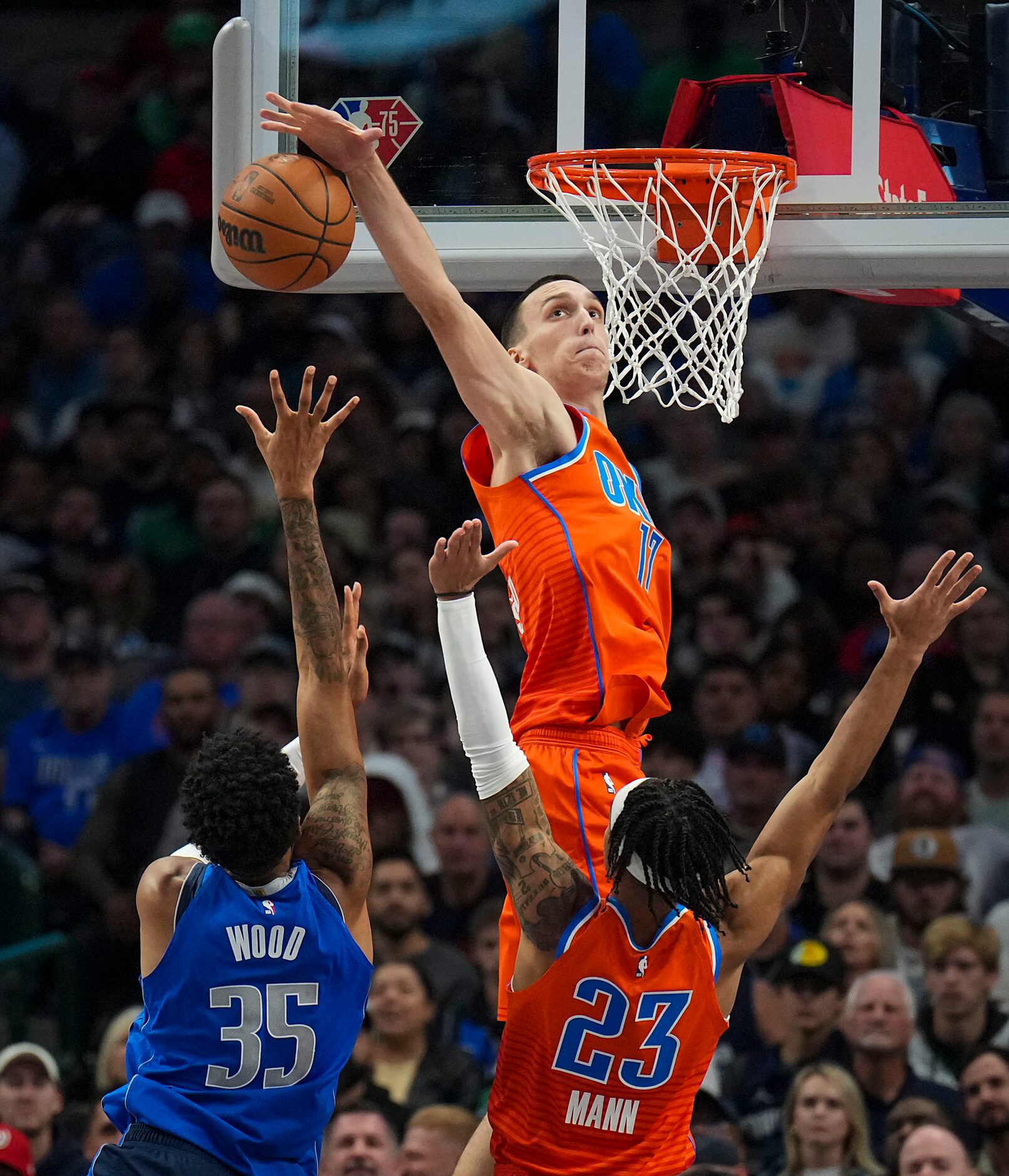 Oklahoma City Thunder forward Aleksej Pokusevski (17) blocks a shot by Dallas Mavericks...