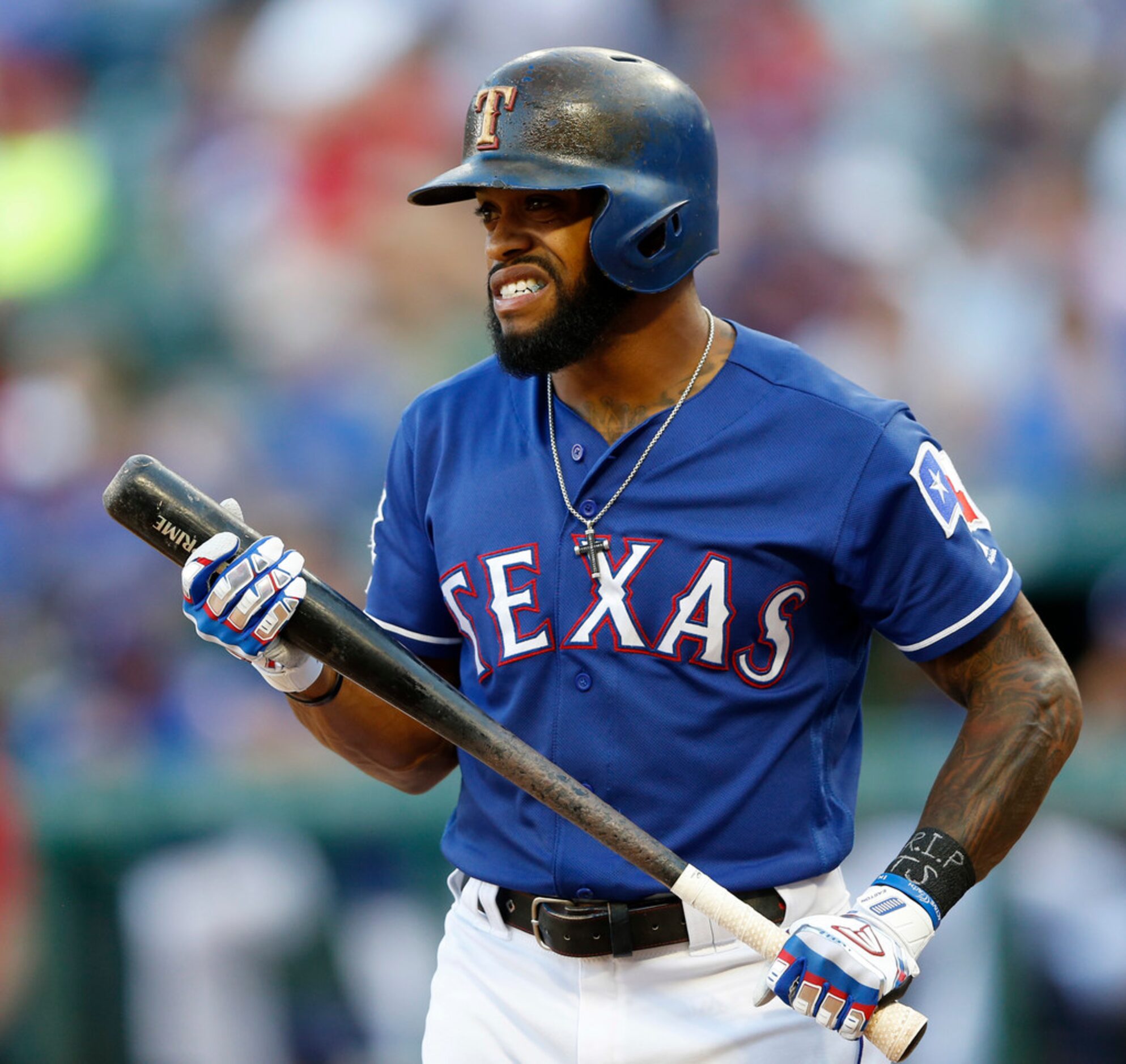 Texas Rangers left fielder Delino DeShields (3) reacts after striking out to Los Angeles...