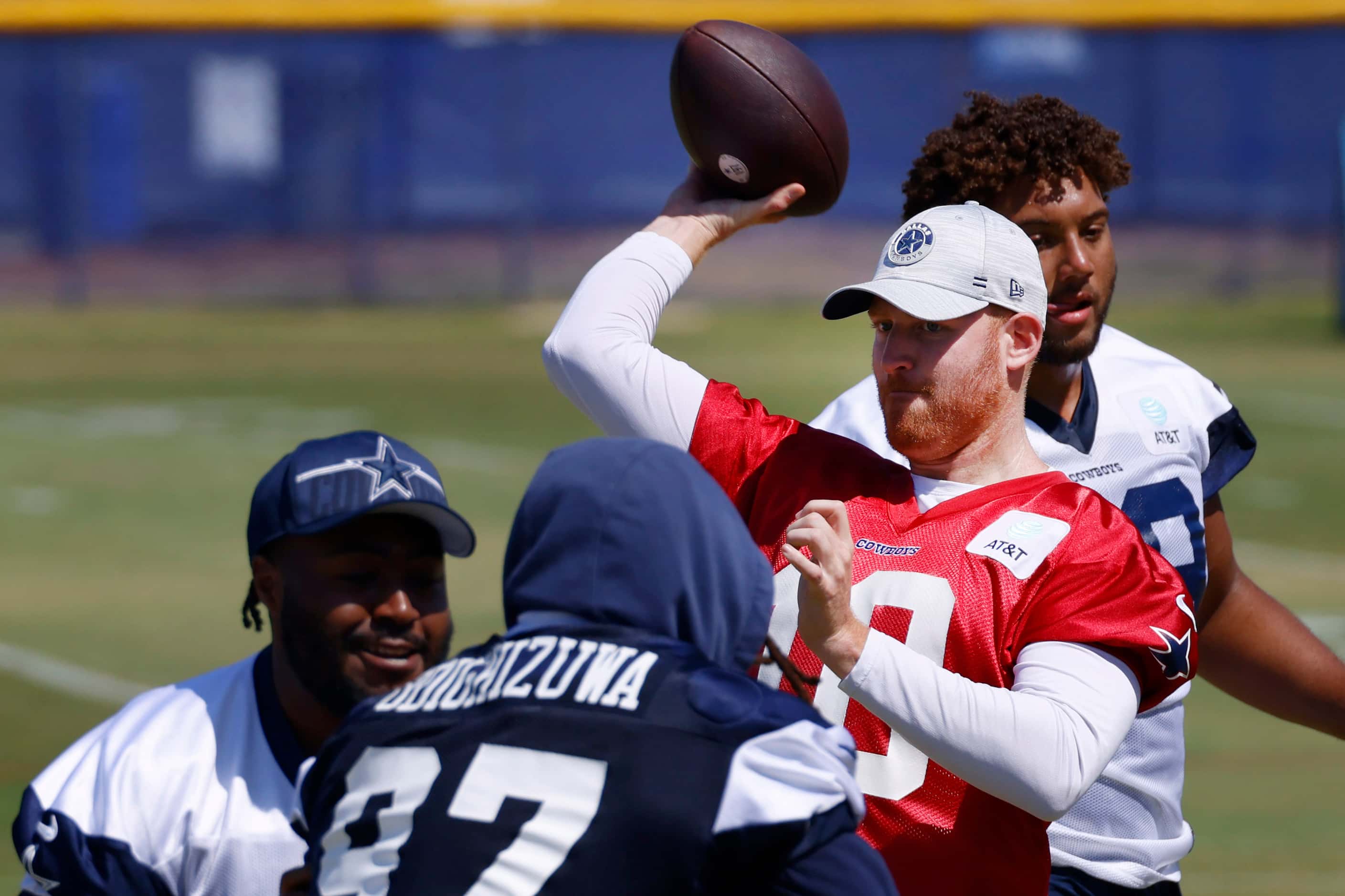 Dallas Cowboys quarterback Cooper Rush (10) tosses a pass during a mock game workout in...