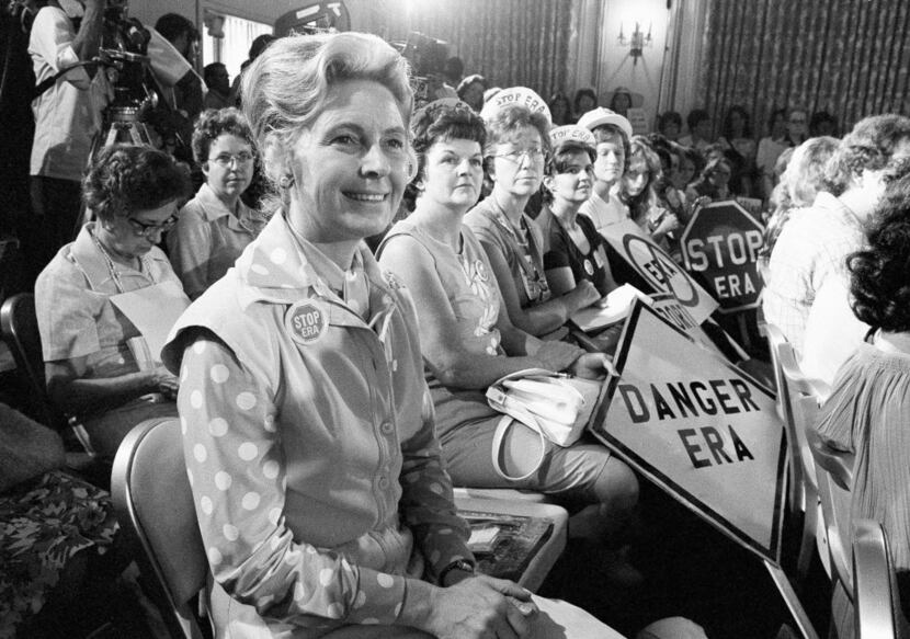 Women opposed to the Equal Rights Amendment sit with Phyllis Schlafly (left) national...