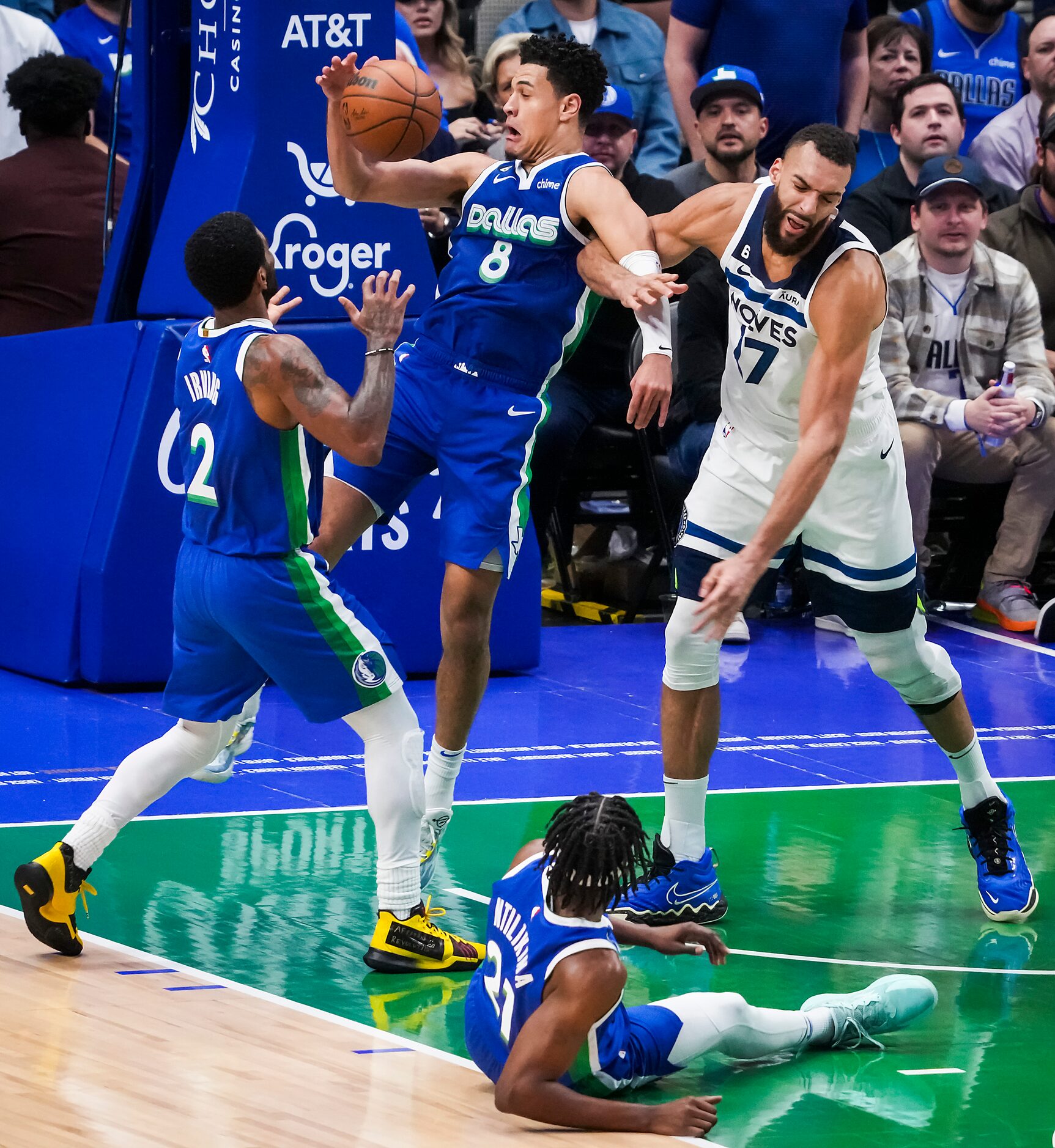 Dallas Mavericks guard Josh Green (8) grabs a rebound away from Minnesota Timberwolves...