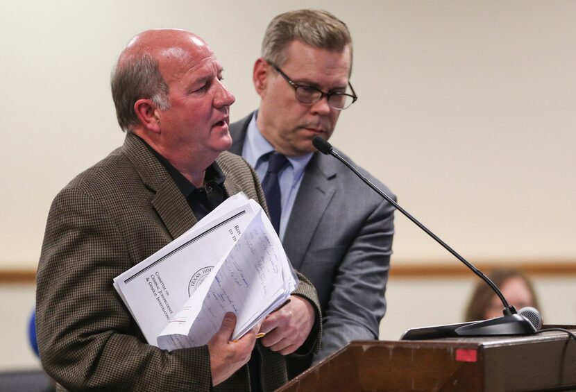 Dale Davenport, left, owner of Jim's Car Wash, testifies as his attorney, Warren Norred,...