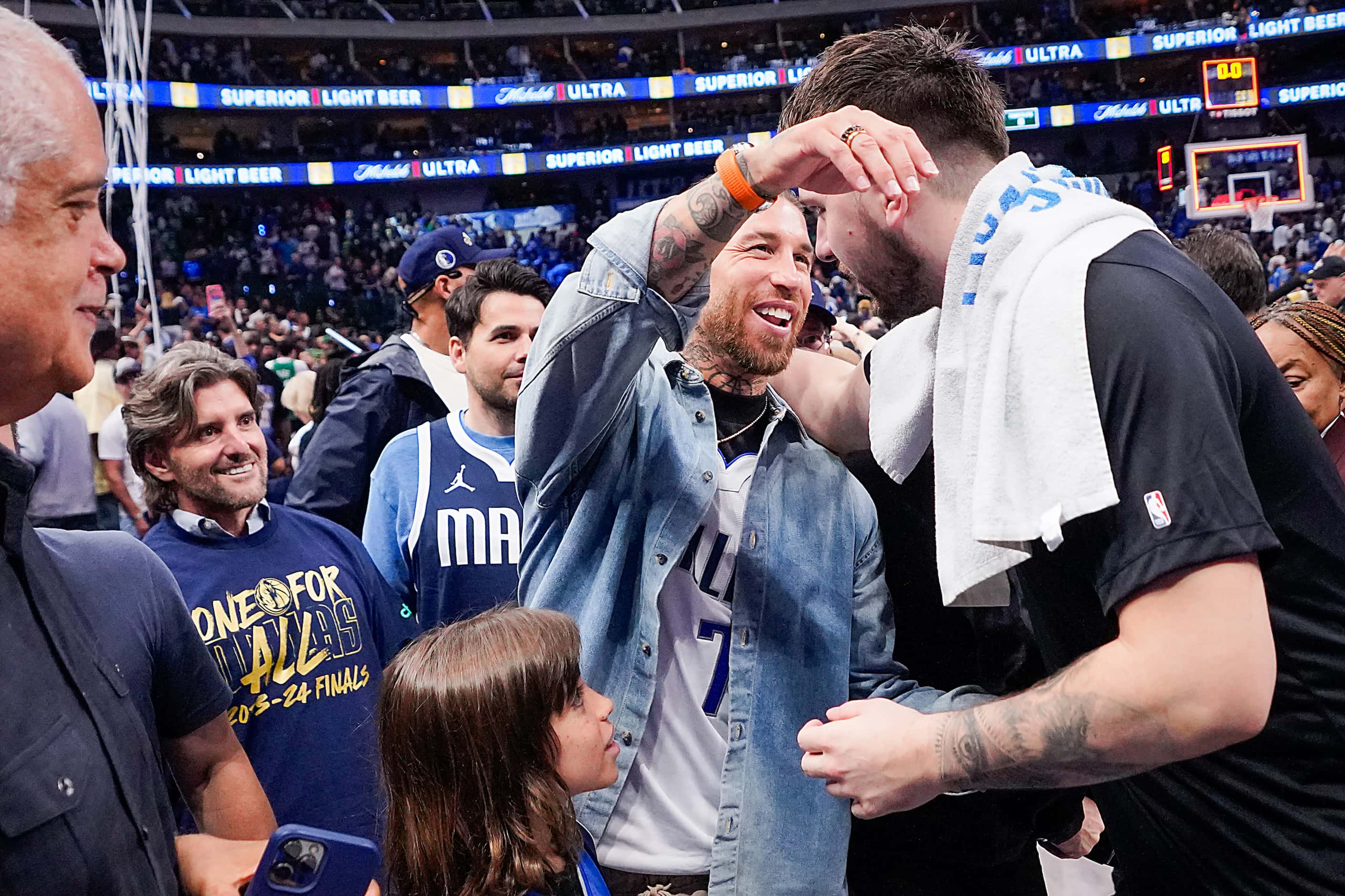 Dallas Mavericks guard Luka Doncic (right) hugs Sergio Ramos after a victory over the Boston...