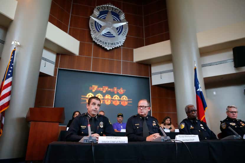 Interim Dallas Police Chief David Pughes (left) speaks alongside Assistant Chief Randal...