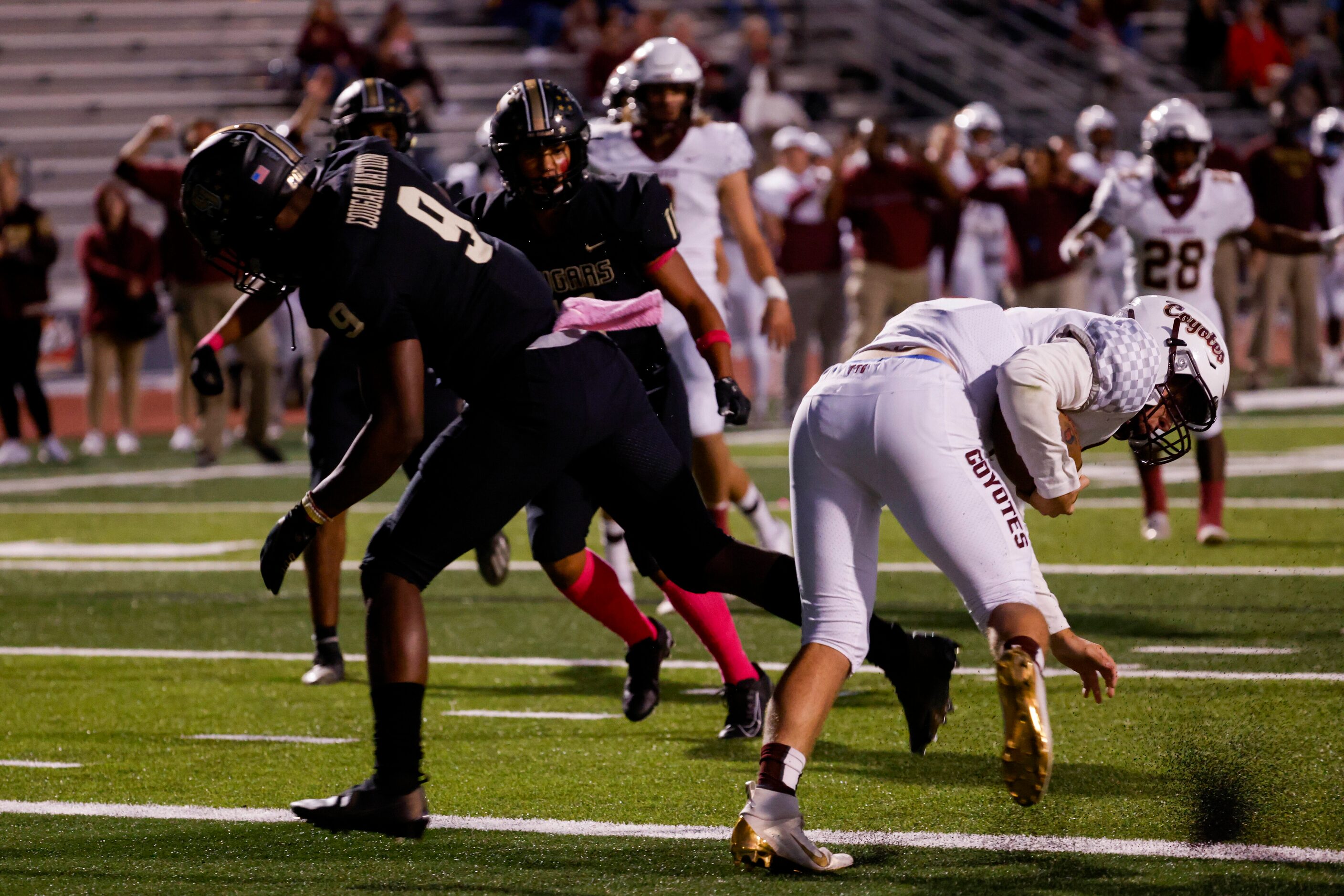 Frisco Heritage’s quarterback Easton Swetnam runs in for a touchdown during the first...