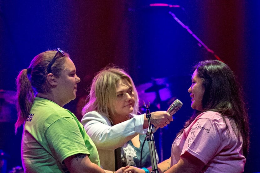 Elle King (center)  performs a wedding ceremony for two women onstage at the House of Blues...