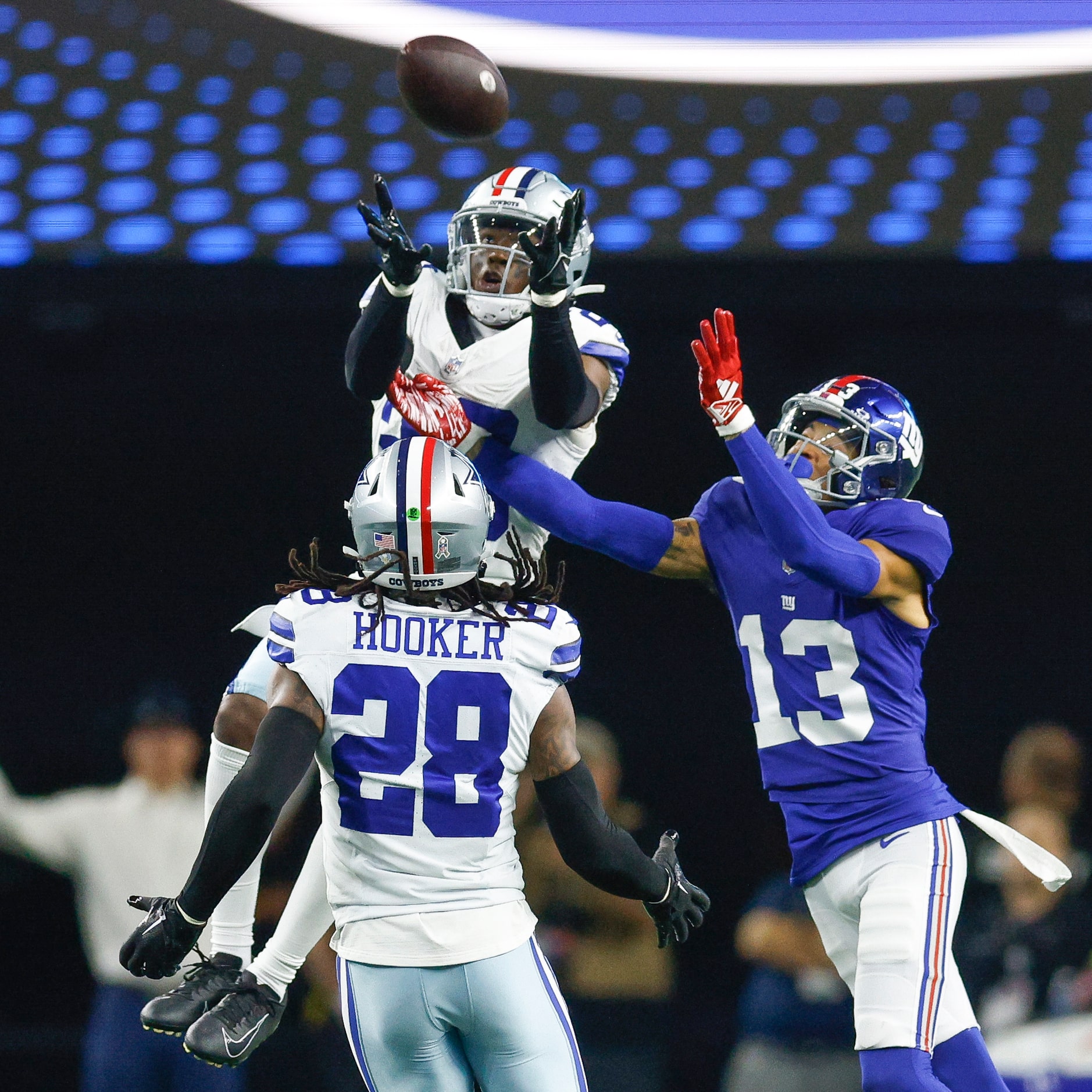 Dallas Cowboys cornerback DaRon Bland (26) intercepts a pass intended for New York Giants...