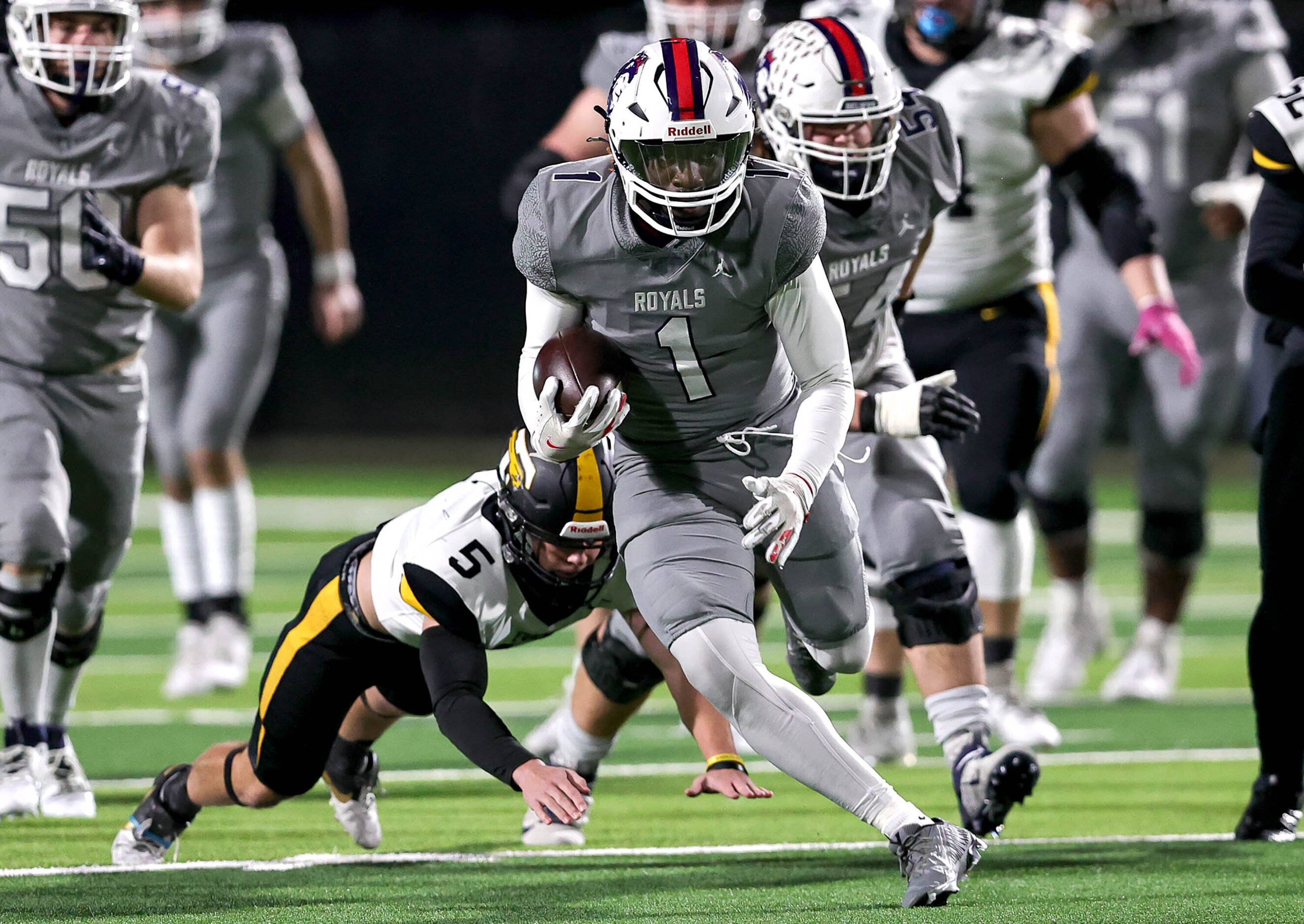 Richland running back Michael Turner (1) looks for running room against Forney during the...