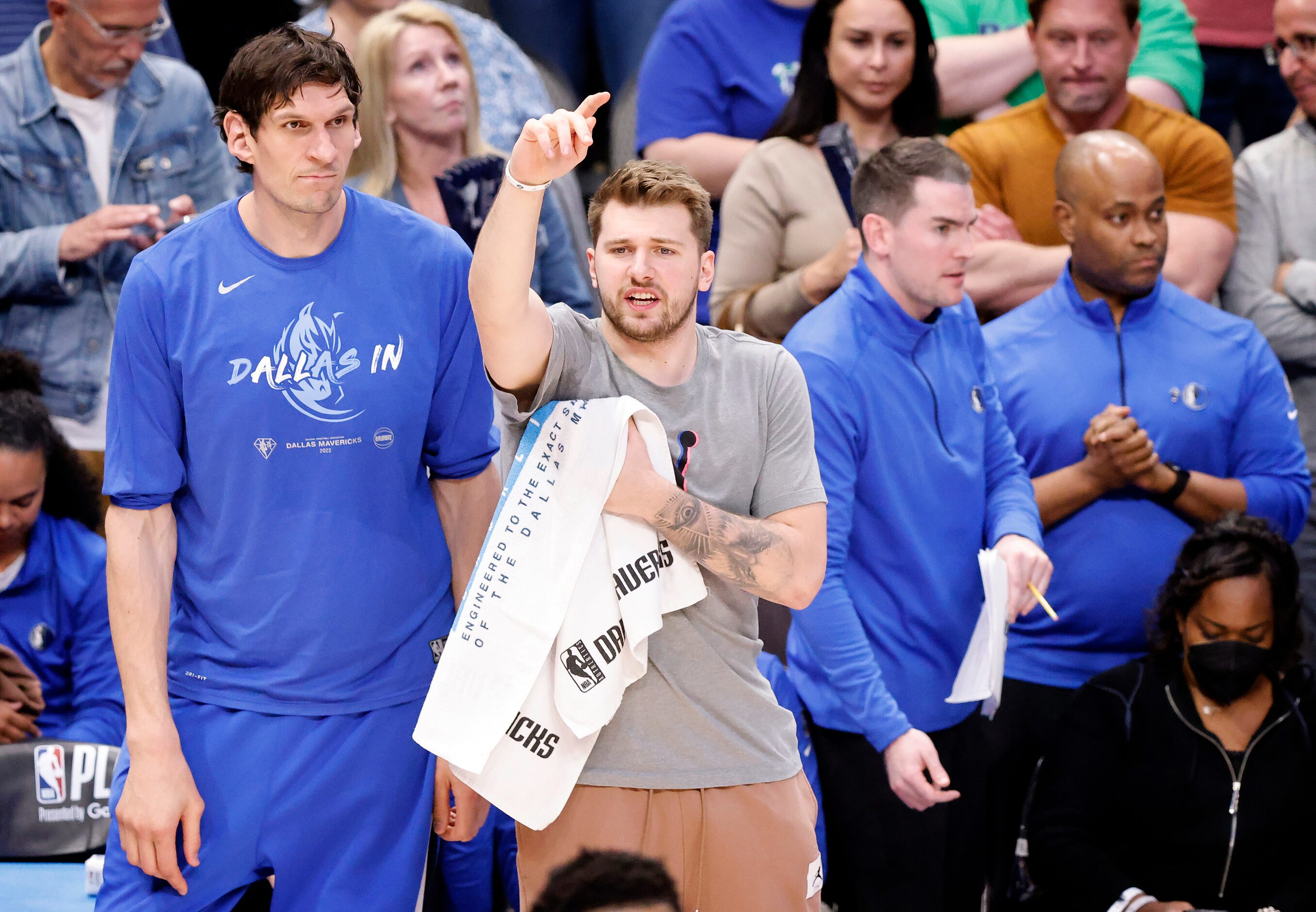 Dallas Mavericks injured guard Luka Doncic gives instruction to his teammates during the...