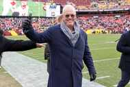 Dallas Cowboys executive vice president Stephen Jones gives a thumbs up before the first...