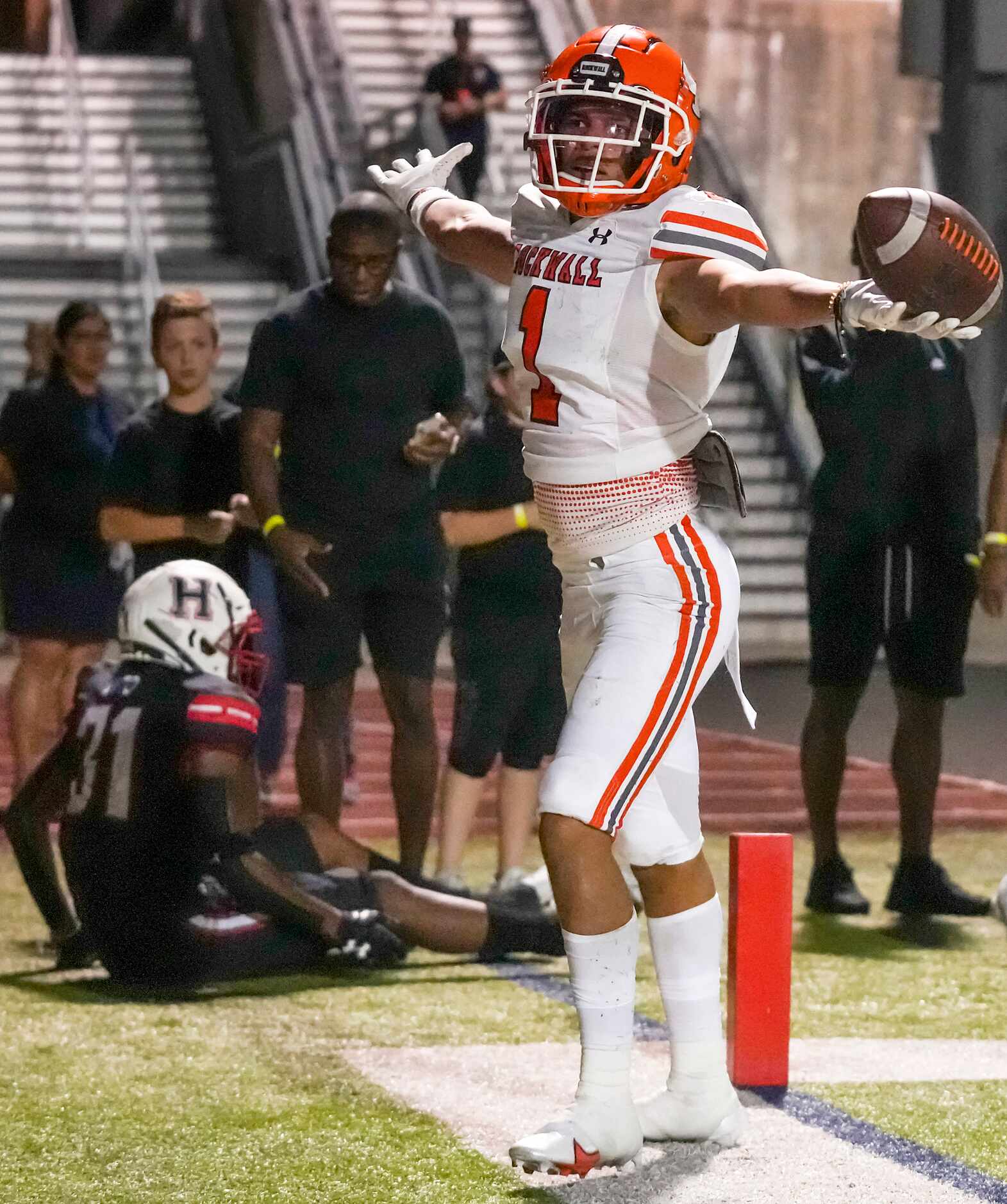 Rockwall wide receiver Aiden Meeks (1) celebrates after catching a 15-yard touchdown pass...