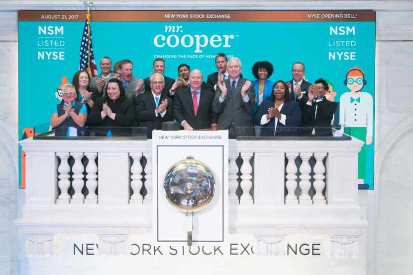 Jay Bray, Chairman and CEO of Mr. Cooper and other company executives after ringing the...